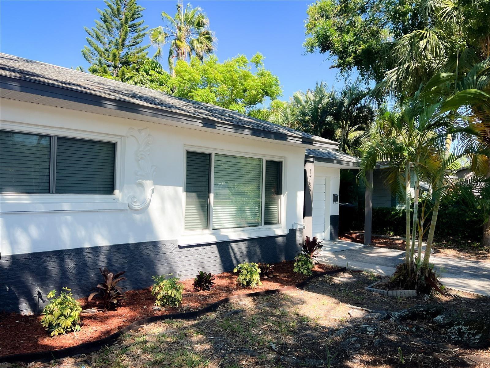One or more photo(s) has been virtually staged. DO NOT DISTURB TENANTS! Property occupied until October 14th of this year, will be vacant at close. Schedule all showings with listing agent. Welcome to this beautifully maintained 3-bedroom, 2-bathroom home featuring a fully paid-off solar energy system—offering both eco-conscious living and long-term savings. Nestled in the desirable Tyrone neighborhood, this property combines thoughtful updates with modern comfort, making it an exceptional opportunity for any homeowner. Inside, you’ll find a bright and inviting layout with LED lighting throughout, modernized bathrooms, and a clean, contemporary interior that has been meticulously cared for—even after a year of respectful tenancy. The home remains in excellent condition, a testament to its quality finishes and the attention it has received. The SOLAR EDGE PV system is fully owned and ready for activation, delivering energy efficiency and reduced utility bills. A transferable warranty provides added assurance for continued solar performance and savings. The primary suite is a standout feature, complete with a spacious seating area, walk-in closet, and elegant French doors leading to a private rear patio—creating a seamless indoor-outdoor flow. The additional two bedrooms are generously sized with ample closet space, perfect for family, guests, or a home office. Step outside to enjoy a large backyard, ideal for outdoor entertaining, gardening, or relaxing in your own green space. Located centrally in Tyrone, you're minutes from shopping, dining, and parks. Don’t miss your chance to own this energy-efficient, move-in-ready home in one of St. Pete’s most convenient neighborhoods!