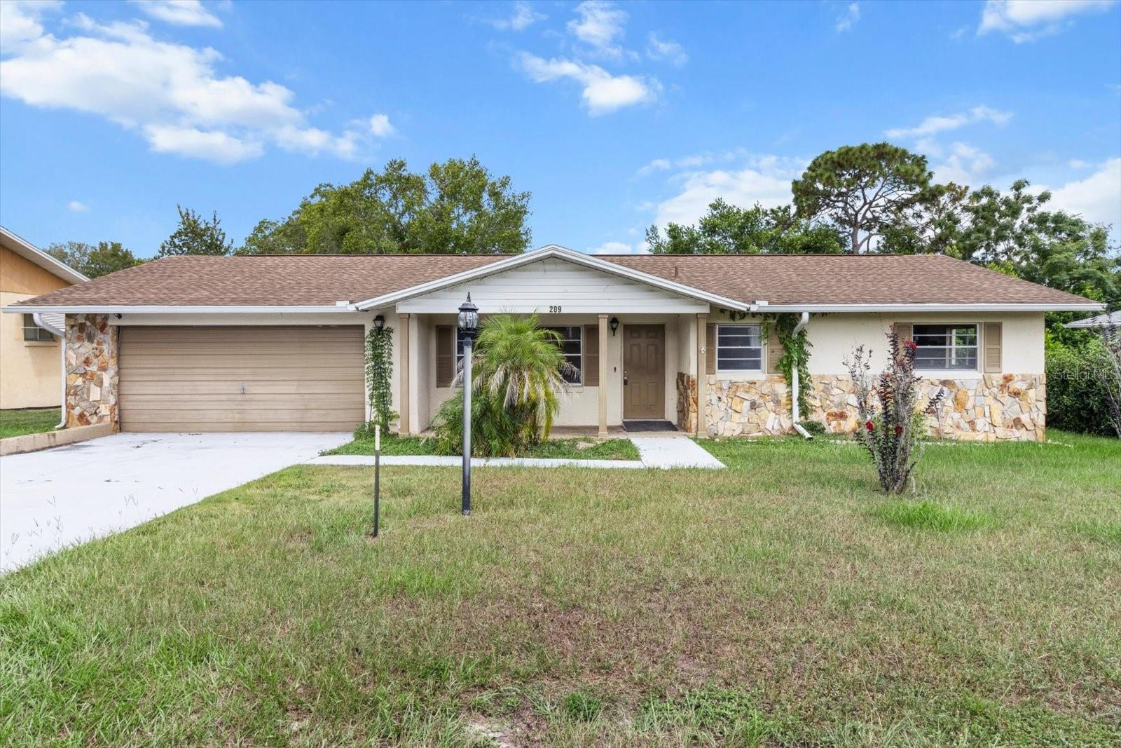 This 2 bedroom, 2 bath Imperial Executive II model home offers a practical layout and a fantastic opportunity to update and customize to make it your very own. The kitchen is a blank canvas with plenty of cabinets, a breakfast nook, and a bar for casual dining. The living and dining area provide ample space for family and guests. There is dual entrance from the family room or the kitchen into the enclosed Florida room - which features new dual pane windows installed in 2020 - perfect for year round enjoyment. The primary bedroom has an en suite bath with walk in shower, walk in closet, with additional closet space along the side wall. The guest bathroom has a tub/shower combo. Freshly painted interior, roof 2017, inside laundry & utility sink for added convenience. This charming home has endless potential! Located in Beverly Hills, you're nearby local parks, trails, shopping and restaurants.