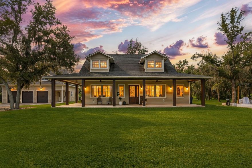 Feel welcomed by the scenic tree-lined country road where sunlight dances through the branches and horses, cows and rolling farmland invite you to a romantic, modern farmhouse with 2 stories and 2 buildings next to each other on a 4.13 acres lot filled with mature oak trees, a cute chicken farm and lots of private space. You will immediately notice the open 1100 sq ft front porch, and stylish fiber cement siding that create a warm, yet polished look. Inside the main house, a 20ft ceiling grabs your attention and an open floor plan awaits featuring a spacious great room with an electric fireplace and abundant natural light. The gourmet kitchen boasts quartz counter tops, stainless steel appliances, a large center island, custom cabinetry and a secluded butler pantry with more cabinetry and counter space. The kitchen shows both cozy, practical and a touch of modern luxury. The primary suite offers a private retreat with a spa-like bathroom featuring a soaking tub, glass enclosed shower and functional vanity. The luxury powder room, a washer and dryer and lots of storage spaces sit nicely tucked away between bedroom and living room. A beautiful crafted stairwell makes a statement the moment you walk in. Upstairs you will find a spacious loft, a charming bedroom and a full bathroom offering the perfect space for a growing family. The second home, with its own separate entrance, at a few steps away, features a 974 sq ft 3 car garage for tools, lawn mowers and tractors. Upstairs you discover a full secondary 1006 under air sq ft living space with one large bedroom, a bathroom, a laundry and more storage space. Want to be creative and turn this into a mother-in-law suite, a home office or even rental potential.......this space adds incredible versatility to the property. This nearly 5-acre lot is a nature lover’s dream, featuring majestic mature oak trees that provide shade and beauty throughout the property. Expansive lawn areas comes with plenty of space for play, entertaining, or simply enjoying the outdoors. A charming chicken coop, a thriving vegetable garden and many mature fruit trees make it easy to embrace a farm-to-table lifestyle right at home. Major roads and highways within minutes, 2 Publix's only 1 mile away. Many major grocery stores like Costco and Target just 15 miunutes away. Beautiful brand new park at walking distance. Lots of shopping and restaurants only 8 minutes away. Do not miss this one!