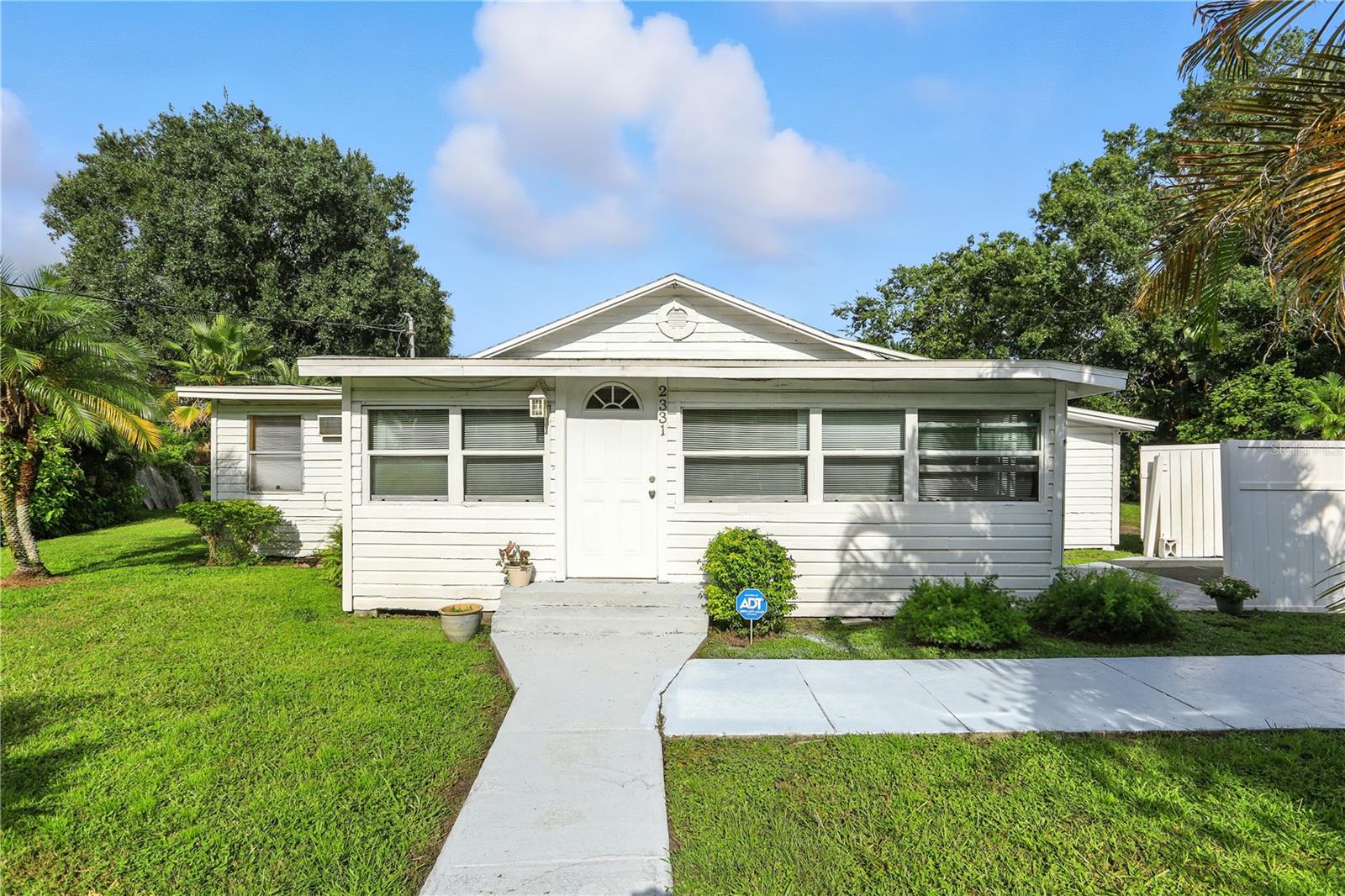 A Historic Sanford Home Waiting for Its Next Love Story
There’s something special about a home with history — one that’s been the backdrop for decades of memories, laughter, and milestones. In Sanford’s charming Midway neighborhood, this 3-bedroom, 2-bath home (plus bonus room) is ready for a new chapter, offering character you can’t buy in new construction and the freedom to create a space that’s uniquely yours.
From the moment you step inside, you’ll feel the potential. Sunlight streams through rows of windows into the cheerful sunroom, a perfect spot for morning coffee or a cozy reading nook. The spacious living and family rooms provides flexible layouts for gatherings, while the eat-in kitchen with bold cabinetry and vintage charm is just waiting for your personal design touch. Bedrooms are warm and inviting, with a bonus room that makes an ideal office, craft space, or storage area.
Outside, the oversized lot with no HOA gives you room to dream — gardens, outdoor dining, weekend projects, or simply a place to enjoy the Florida sunshine. The large deck offers a quiet retreat surrounded by mature greenery.
Several major updates are already complete:
Roof – 2021
Windows – approx. 10 years old
Water Heater – 2016
Refrigerator – 2 years old
Like any home with a little age, there are upgrades still to be made — some may be needed for financing and others you’ll choose to fit your style. FHA buyers should be aware there could be repairs flagged after appraisal. The seller is open to creative solutions, including escrow holdback or a credit at closing, to help make your vision possible. With a little planning, this could be your perfect canvas to create the home you’ve always imagined.
With a full price contract: All current furniture can remain, and bi-weekly lawn care will be provided for 6 months to make settling in easier.
Just minutes from Sanford International Airport, downtown’s festivals and breweries, the scenic lakefront, and a brand-new Publix, this location offers small-town warmth with big-city perks. In a growing neighborhood within desirable Seminole County schools, this is more than a house — it’s a place where your story can begin.