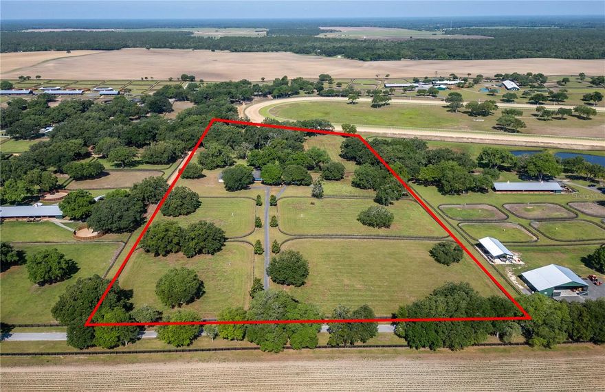 Seller says bring offers!  Train your champions within a gated professional equine community! Situated within Oak Ridge Training Center, this exceptional farm offers a strong foundation perfect for those looking to take their thoroughbred operation to the next level. Designed by professionals for professionals, the 20+ acre farm features gently rolling land dotted by mature oaks providing the perfect amount of shade. At the heart of the property is the 20-stall shedrow style barn, which comes equipped with a wash rack with hot water and a barn apartment which could be used instead as a barn office. A total of 5 paddocks are currently established, each equipped with auto-waterers for added ease of care, as well as an additional round pen. An RV hookup is also in-place, adding additional options for short-term or longer term residency right on the property. Oak Ridge Training Center offers owners access to the 1-mile dirt track, which includes a 6-stall starting gate that meets current racing standard, and the more recently added 7/8 mile turf track. Both tracks are lighted and meticulously maintained using the highest industry standards and specifications, with daily maintenance of the track and yearly stripping, checking, and regrading to ensure quality. Located just outside of Ocala and a short drive to Gainesville, this facility offers easy access to a variety of feed and tack retailers, world-class veterinary care, farriers, and other specialty service providers throughout the area. In an area known as the Horse Capital of the World®, this farm is perfect for those looking to take advantage of the year-round warm climate and close proximity to Ocala Breeder’s Sales. Get ready to start your horses off on the right track with this exceptional property!