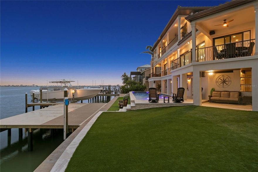 Where to begin.....This incredible, completely remodeled waterfront home in the highly desirable community of Pasadena Yacht and Country Club is now awaiting its new owners. This home boasts over 6900sq ft which includes over 1500 of covered porches. Plan to be wowed by all the extras, all the thoughtfulness and upgrades this home has to offer. As you pull up to this stunner you are welcomed by an oversized driveway with porcelain pavers and turf in between. The new and extended staircase, hidden storage, expanded balcony, NEW 2025 concrete tile roof and the exquisite custom wrought iron front doors with rain glass and a screen will take your breath away you haven't even stepped inside. Once you enter you are able to enjoy the expansive waterfront views, fully remodeled kitchen (with surprises throughout), new windows, doors, hidden outlets, dedicated bar area, Invisi cooktop, Top Zero large sink, reverse osmosis, translucent illuminated onyx countertop and so much more. Take the elevator up to the third floor which is dedicated to the Master that has it all. From a movie projector in your bedroom, his and her walk-in closets, secret closet, his and her water closets, washer, dryer and wet bar. You may never want to leave! Prepare to be amazed when you see what the downstairs has offer! Bonus spaces, outdoor kitchen, new 900sq ft dock with a 16k lb lift, jet ski lift, deep wet slip and floating dock that includes 2 kayak launching pads and a jet ski dock. The new heated pool and jetted spa is managed by Aqualink and has all the bells and whistles needed. THE VIEWS........they speak for themselves with over 135 feet to enjoy! Move in, relax and enjoy. Pasadena Yacht and Country club is gated and includes a 24hr fitness center, pickleball courts, summer camps, pool, marina, tennis courts, golf and 3 restaurants. Jump the 5 year waitlist by purchasing this home. All furnishing, appliances, tvs, sound equipment stays!!!