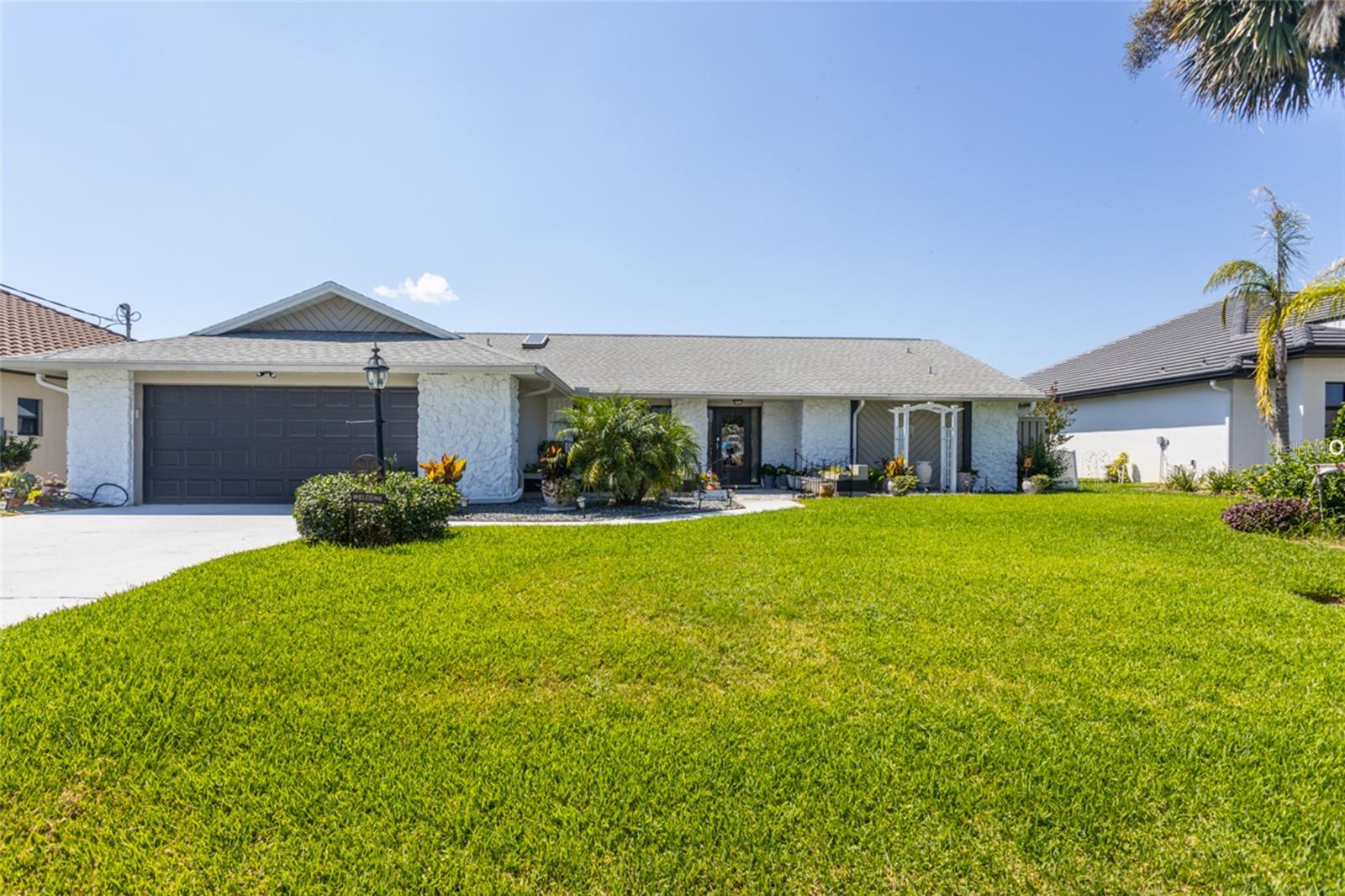 Discover the perfect blend of Florida comfort and timeless charm in this well-maintained 3-bedroom, 2-bath canal-front home, tucked away on a quiet cul-de-sac in one of Palm Coast’s sought-after waterfront neighborhoods. Situated on an expansive 80-foot saltwater canal lot, this home offers quick access to the Intracoastal Waterway—ideal for boaters, kayakers, and water lovers alike.
Inside, the thoughtfully designed layout features both a living room and a separate family room, offering space for entertaining, relaxing, or daily living. The kitchen includes stainless steel Whirlpool appliances, a center island, tile backsplash, and charming architectural accents that give the space personality and warmth. The family room is accented by attractive faux wood beams that appeal to the eye.
Step into the large enclosed Florida room, fully tiled and filled with natural light. Take in beautiful views of the water—ideal for morning coffee, quiet afternoons, or entertaining guests.
Tile flooring runs throughout most of the home, with carpeted two bedrooms. You'll also appreciate the indoor laundry room, 2022 A/C unit, and the recently repainted exterior that enhances curb appeal. The yard is nicely manicured, providing a welcoming first impression and easy maintenance.
Bonus: This home includes an assumable VA loan at an exceptional 2.75% interest rate, offering a valuable opportunity for qualified buyers to secure low-cost financing.