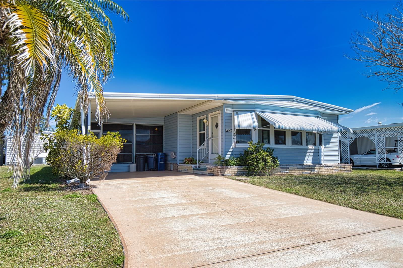 Embrace the Florida dream lifestyle in this charming home, located on a quiet street in this vibrant 55+ community. Inside, the house feels open, featuring a kitchen/dining room combination that flows into a comfortable living room, making it perfect for entertaining. The kitchen features Corian countertops and updated cabinets which match the updated dining room built ins. The front family room is an ideal spot for a home office, or crafting room. Retreat to the sanctuary of the primary bedroom, which includes an ensuite bath with a walk-in shower. The guest bedroom is designed to make your visitors feel welcome, with a convenient bathroom located just outside the door. It's a perfect opportunity to update, personalize, and truly live the Florida dream. Recent updates include a new vapor barrier (2022), a new metal roof (2024) new windows, an A/C unit (approximately 2021) with an extended warranty until 2029., a new carport (2024), and a new lanai (2024). Discover the enchanting community of La Casa, where 974 stunning homes are elegantly nestled among a tapestry of native trees, offering a serene escape surrounded by spacious common areas and eight picturesque lakes. Our generous lots average an impressive 60 by 80 feet, providing ample space for your dream home. Perfectly situated between Sarasota and Fort Myers, La Casa embodies the ultimate lifestyle on Florida’s Gulf Coast—a true boaters paradise with direct access to the breathtaking Gulf of Mexico. Enjoy the convenience of nearby shopping, exciting sightseeing, world-class golfing, and abundant fishing and boating opportunities, all while indulging in the rich culture and refined elegance that Southwest Florida is celebrated for. As you immerse yourself in the warmth of Southwest Florida’s winters, you’ll find yourself in a relaxed and unhurried atmosphere, far removed from the hustle and bustle of the east coast. Our community is adorned with lush, mature landscaping that reflects the loving care both residents and management dedicate to preserving its beauty. At La Casa, you’ll discover some of the finest pools in the area. Our crowning jewel is a magnificent 40 by 60-foot swimming pool, maintained at a perfectly inviting 87 degrees. Just a short stroll away, you’ll find our cozy 20 by 40-foot pool, nestled charmingly between the clubhouse and the Activity Building. Both pools feature adjacent hot tubs, ideal for unwinding after a refreshing day of golf or an invigorating game of tennis. Stay connected while basking in the sun with our complimentary wireless Internet (Wi-Fi), available at the Clubhouse, Activity Building, and Recreation Hall. Whether you’re catching some rays or catching up on emails, La Casa has it all. Does this sound appealing? La Casa is not just a community; it’s a welcoming family-friendly haven. Enjoy the tranquility of your surroundings, with the vibrant energy of nearby attractions just a heartbeat away. Come visit our charming self-contained oasis and experience firsthand why La Casa is the ultimate destination for snowbirds and year-round residents alike!