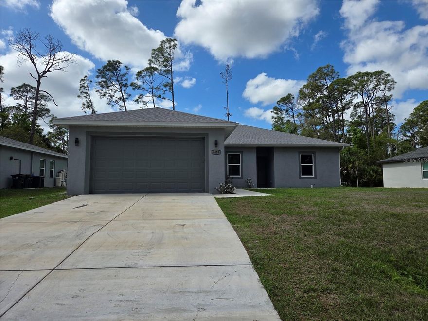 LOOKS LIKE NEW!!!  3 BEDROOM 2 BATH WITH IMPACT WINDOWS AND DOORS. BEAUTIFUL KITCHEN AND ISLAND WITH QUARTZ COUNTERTOPS. PORCELAIN TILE ON THE ENTIRE HOUSE. CEILING FANS, LAUNDRY ROOM AND NICE SIZE PORCH, IS READY TO MOVE IN !!!