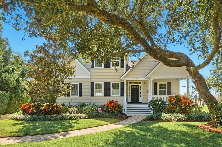 A hidden gem in Mount Dora! This spectacular home is ideally on the highest ridge in Mount Dora and within short distance of historic and charming downtown with shops, restaurants and more. Mount Dora is a small waterside town on the 77,000-plus-acre Harris Chain of Lakes offering great boating, fishing, events and festivals throughout the year. Upon arrival at this immaculate three-story home, you will notice the mature oak trees, white picket fence and private setting at end of the street. It has an inviting front porch with a bench swing that says, I’m home. Upon entering, the foyer welcomes your guests to the huge living room with separate office/den, or playroom, but your eyes will immediately be drawn to the beautiful enormous windows with the sunlight beaming in and the treetop views through the whole main floor. Hardwood floors, hickory wood doors and a stunning gas fireplace with marble accents for cozy gatherings with family and friends. Cathedral ceilings, an open floor plan, French doors and a large covered porch with volume tongue and groove wood ceiling, new epoxy flooring makes this home an entertainers dream and a lovely place to enjoy sunsets. The kitchen is spectacular and cheerful with lots of natural light and many amenities, including a large center island, a pass-through to the living room, numerous cabinets for storage, a pantry, high-end appliances, and a beautiful stained glass lighted accent piece designed and handmade by the architect. The main floor primary bedroom again features cathedral ceilings, French doors that open to a sunbathing porch connected to the covered porch. The private bath has double vanities, tub with separate oversized shower and linen closet. As you proceed upstairs to the second level, you find two large bedrooms each with full bath. The bedroom in the rear of the upstairs could be a great guest suite or a second primary bedroom with French doors opening to a Juliette balcony. Both bedrooms feature hardwood flooring, walk-in closets and have sitting room niches. Throughout the home you will find custom shutters and blinds, and a tankless water heater. Each floor has its own HVAC unit. As you proceed to the lower level of the home, you find a wonderful in-law apartment with all bells and whistles. An extra-large living/great room, private bedroom with walk-in closet and full bath, and a full-size kitchen with all appliances included, as well as great cabinet space. Lots of windows to let in the light, and French doors exiting to a spacious covered patio to enjoy your morning coffee or just enjoy the view of the beautiful manicured backyard, with private access from the French doors or through the oversized three-car garage. This downstairs area could be rented out or even used for an Airbnb, especially during events held in Mount Dora. It can also be locked off from the other two floors of the home when in use for safety. Garage is equipped with lots of cabinets and ample storage. This one is must-see. Now it’s time to make your own memories.