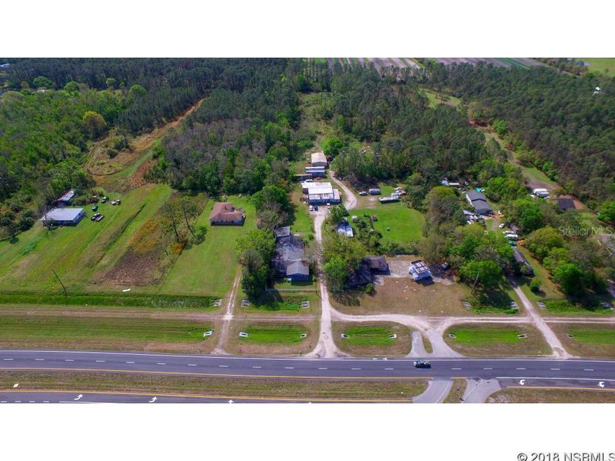 Pool home with 8 acres in Samsula.Doublewide trailer24 x 24 Efficiency Apartment60 x 60 outbuilding35 x 48 outbuildingClose to 95 and New Smyrna Speedway. Great Location and Property.Could be used for Primary Residence or Investment.

THIS HOME IS NOT MOVE IN READY.
THE PROPERTY NEEDS WORK.