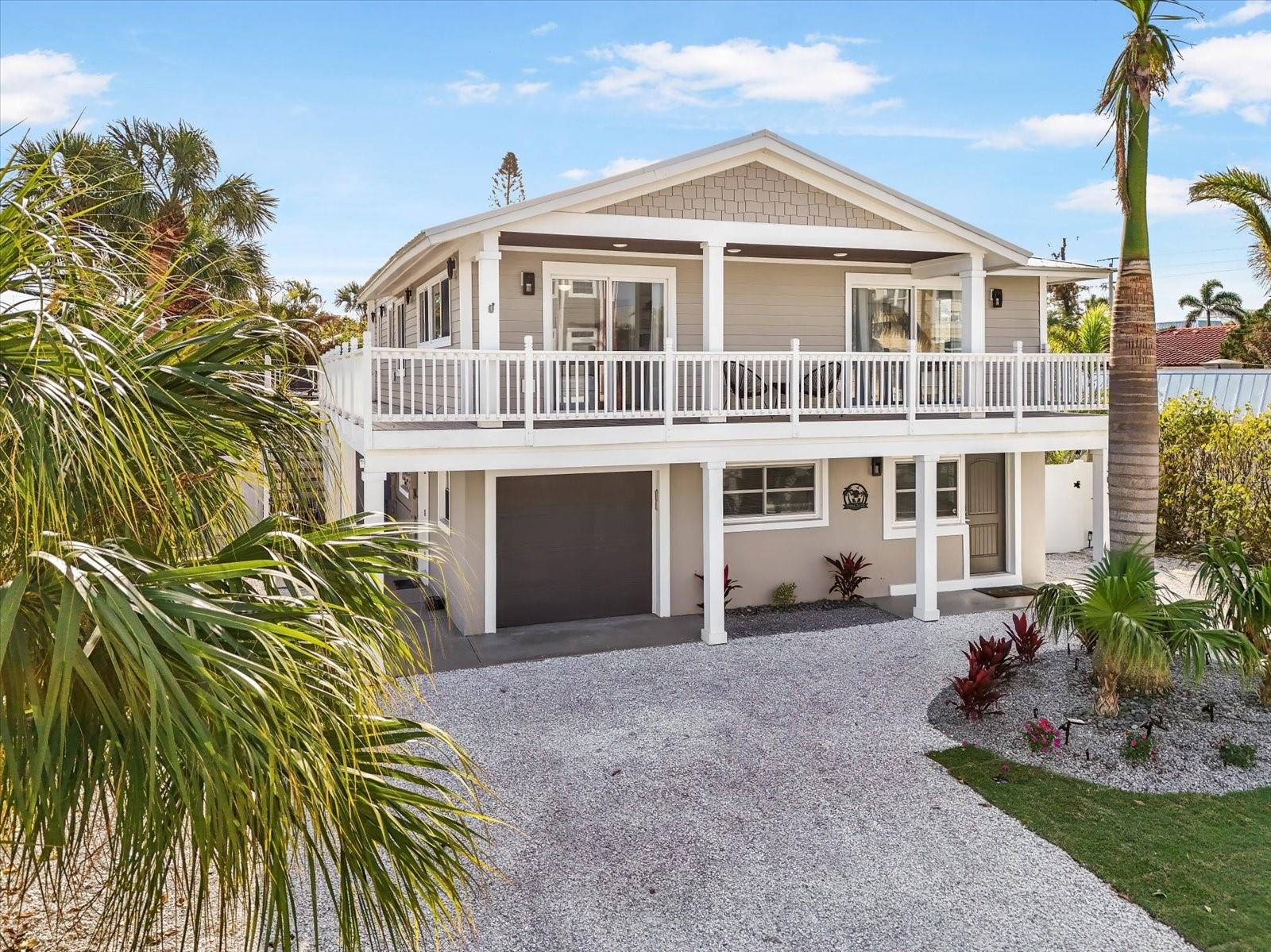 MOTIVATED SELLER!! Welcome to Tidal Daze, an exceptionally decorated and fully furnished 4-bedroom, 3.5-bathroom island retreat in the heart of Holmes Beach.
This thoughtfully designed home offers flexibility and comfort with dual living spaces – both the upper and ground levels feature 2 bedrooms and 2 bathrooms, ideal for multi-generational living or guests who prefer single-level accommodations.
Open & Airy Interior Living
At the heart of the home, the second-floor open-concept layout combines the kitchen, dining, and living areas into a welcoming gathering space. The kitchen includes a pantry, spacious island, and modern finishes, seamlessly connecting to the dining area for everyday living and entertaining. Coastal-inspired décor and abundant natural light create a relaxed yet refined atmosphere throughout.
Resort-Style Outdoor Oasis
Step outside to your private backyard sanctuary complete with:
Oversized heated pool with sun shelf and color-changing lights
Large turf play area and 3-hole putting green
Covered patio with mounted TV for outdoor enjoyment
Custom outdoor shower for post-beach refreshes
Private parking for up to 6 vehicles, plus a garage for storage and golf cart
Location & Lifestyle
Just 200 yards from the Gulf’s sugar-sand beaches, Tidal Daze offers the perfect balance of small-town charm and coastal beauty. Holmes Beach is known for its vibrant dining, boutique shopping, and endless outdoor activities – from boating and paddleboarding to biking along the island.
With a proven 5-star rental history, this home is also an excellent investment opportunity for buyers seeking a property with income potential.