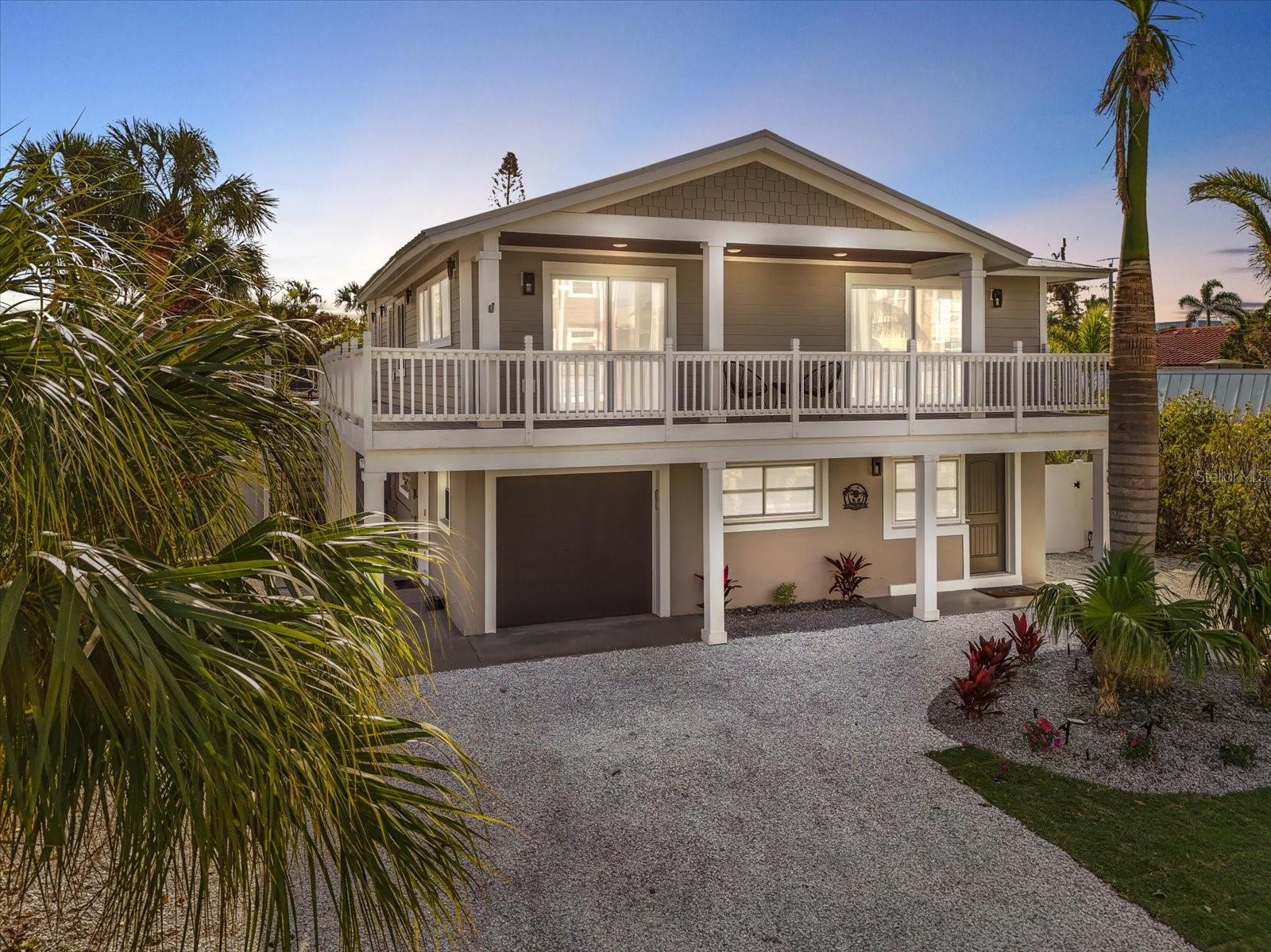 MOTIVATED SELLER!! Welcome to Tidal Daze, an exceptionally decorated and fully furnished 4-bedroom, 3.5-bathroom island retreat in the heart of Holmes Beach.
This thoughtfully designed home offers flexibility and comfort with dual living spaces – both the upper and ground levels feature 2 bedrooms and 2 bathrooms, ideal for multi-generational living or guests who prefer single-level accommodations.
Open & Airy Interior Living
At the heart of the home, the second-floor open-concept layout combines the kitchen, dining, and living areas into a welcoming gathering space. The kitchen includes a pantry, spacious island, and modern finishes, seamlessly connecting to the dining area for everyday living and entertaining. Coastal-inspired décor and abundant natural light create a relaxed yet refined atmosphere throughout.
Resort-Style Outdoor Oasis
Step outside to your private backyard sanctuary complete with:
Oversized heated pool with sun shelf and color-changing lights
Large turf play area and 3-hole putting green
Covered patio with mounted TV for outdoor enjoyment
Custom outdoor shower for post-beach refreshes
Private parking for up to 6 vehicles, plus a garage for storage and golf cart
Location & Lifestyle
Just 200 yards from the Gulf’s sugar-sand beaches, Tidal Daze offers the perfect balance of small-town charm and coastal beauty. Holmes Beach is known for its vibrant dining, boutique shopping, and endless outdoor activities – from boating and paddleboarding to biking along the island.
With a proven 5-star rental history, this home is also an excellent investment opportunity for buyers seeking a property with income potential.