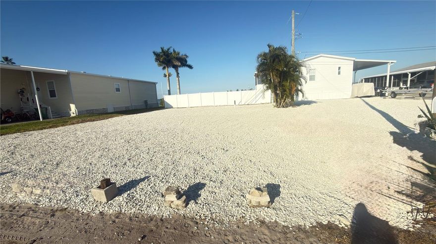 RARE FIND: Premium Land-Owned mobile Home zoned Lot with only $100 annual fees!   - Terra Ceia Bay - Once buyer puts a new Mobile Home on the lot - Home will have great water views. 

Discover one of the few coveted LAND-OWNED lots in Tropic Isles where you'll pay just $100/year in fees - a fraction of what most community residents pay!   Lot is Ready with utilities to site - above flood height required and will pay off with amazing water views!  Perfect location near I-75, shopping, and Snead Island nature preserve. Ready for immediate development -  Don't miss this rare opportunity to own one of the few low-fee lots in this desirable waterfront community!