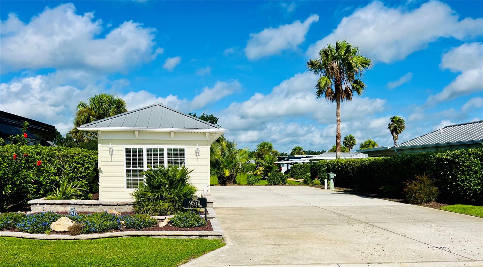 Welcome to Lot 26 at Florida Grande Motor Coach Resort, a stunning east-facing back-in
property offering peaceful views, luxury touches, and a strong sense of community. This 5,076
sq ft lot features a 26'x76' concrete pad with low-maintenance landscaping and picturesque views
of the neighboring pasture—perfect for relaxing on the front porch as the sun rises. The 384 sq ft
furnished Grande Suite is beautifully appointed with a chair-and-a-half and a sofa, both with
pull-out beds for extra guests. The standout kitchenette boasts granite countertops, a matching
granite island with four bar stools, and a third coordinating bar cart—all on wheels to adapt to
your needs. A full bath includes a walk-in shower, new vanity, and built-in wall storage, while
the spacious back laundry room offers washer/dryer, water softener, and abundant shelving to
keep your motorhome clutter-free. Florida Grande is a gated Class A and Super C resort known
for being the friendliest and most welcoming motorhome community in Florida. From a newly
renovated clubhouse and resurfaced pool to eight brand-new pickleball courts, a dog park, and a
full calendar of events in the winter season, this resort has something for everyone. Perfectly
located just an hour from Tampa, Orlando, and Ocala, Lot 26 is the ideal home base to explore
Central Florida. Come see why neighbors become lifelong friends at Florida Grande—we can't
wait to welcome you!