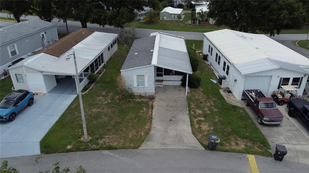 Photo of 50989 Highway 27 #33, Davenport, FL 33897 (MLS # O6412019)