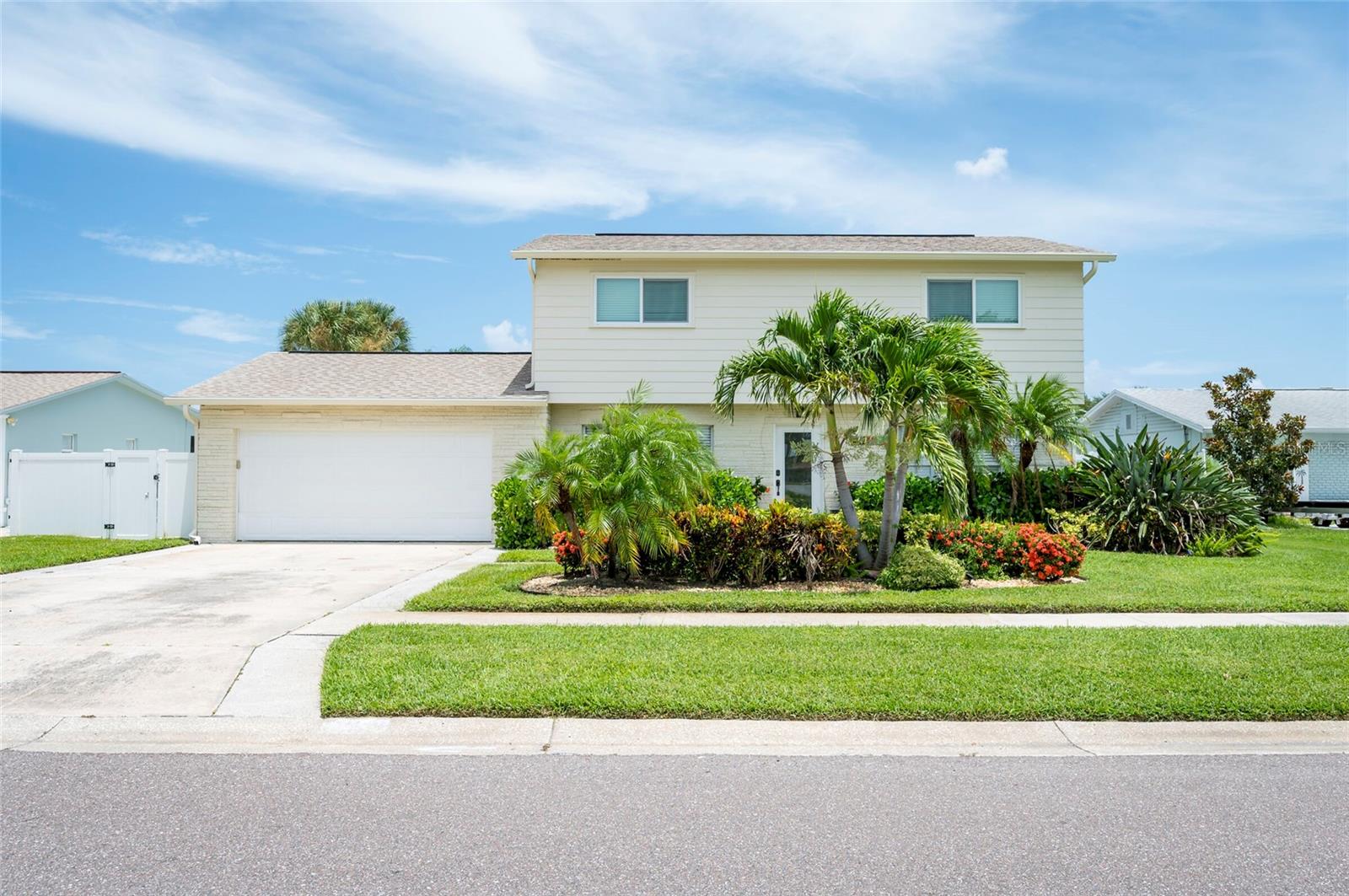 Welcome to 8425 Flagstone Drive, a true waterfront gem nestled in Tampa’s desirable Bay Crest Park community. Situated on a 100-foot wide saltwater canal with direct access to Tampa Bay, this property offers the ultimate Florida lifestyle—whether you're boating, entertaining, or exploring its strong potential as a short-term rental investment. Step outside to your private dock, complete with 13,000 lb boat lift and durable composite decking, making it easy to launch for a short cruise to popular waterfront dining destinations.The backyard is a tropical paradise, featuring a resort-style heated pool, covered gazebo, putting green, a sandy beach area, and lush landscaping. Inside, the chef’s kitchen is a showstopper, equipped with stainless steel appliances, leathered marble countertops, ceramic tile backsplash, island seating, and a wet bar. This spacious home includes two master suites—one upstairs and one downstairs. The converted 2-car garage has been transformed into a large game room, adding even more room to live and play. Other highlights include a new roof (2022) and an unbeatable location in a no-HOA neighborhood with a resident boat ramp. Don’t miss this rare opportunity to own a versatile waterfront property that checks all the boxes for luxury living, entertaining, and income potential.