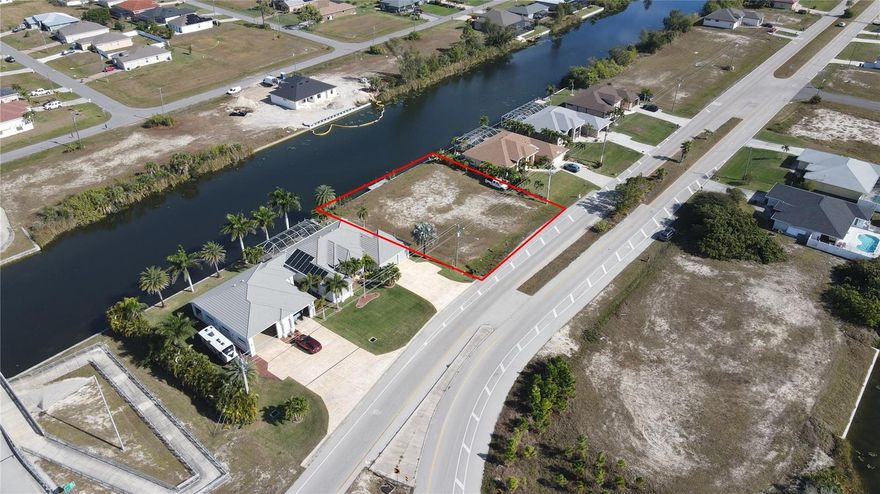 Waterfront triple lot with 120ft frontage totaling 0.34 acres is located in  NW Cape Coral and is ready for your future home! Seawall AND dock by Williamson Bros were built in 2024.  The lot is on one of the widest canals in Cape Coral. Enjoy peaceful water views and the added value of canal frontage, ideal for kayaking, fishing, or simply relaxing in your own backyard oasis. Find Peacock bass right off your dock, and if you want snook/saltwater fishing, head over to the bridge 2 lots to the west where all the saltwater fish wait for bait to come off the spillway. Get the benefits of saltwater without the saltwater price. Everything you need is within minutes via Burnt Store Rd. Just minutes to Matlacha, Burnt Store Boat Ramp, Publix and more.
