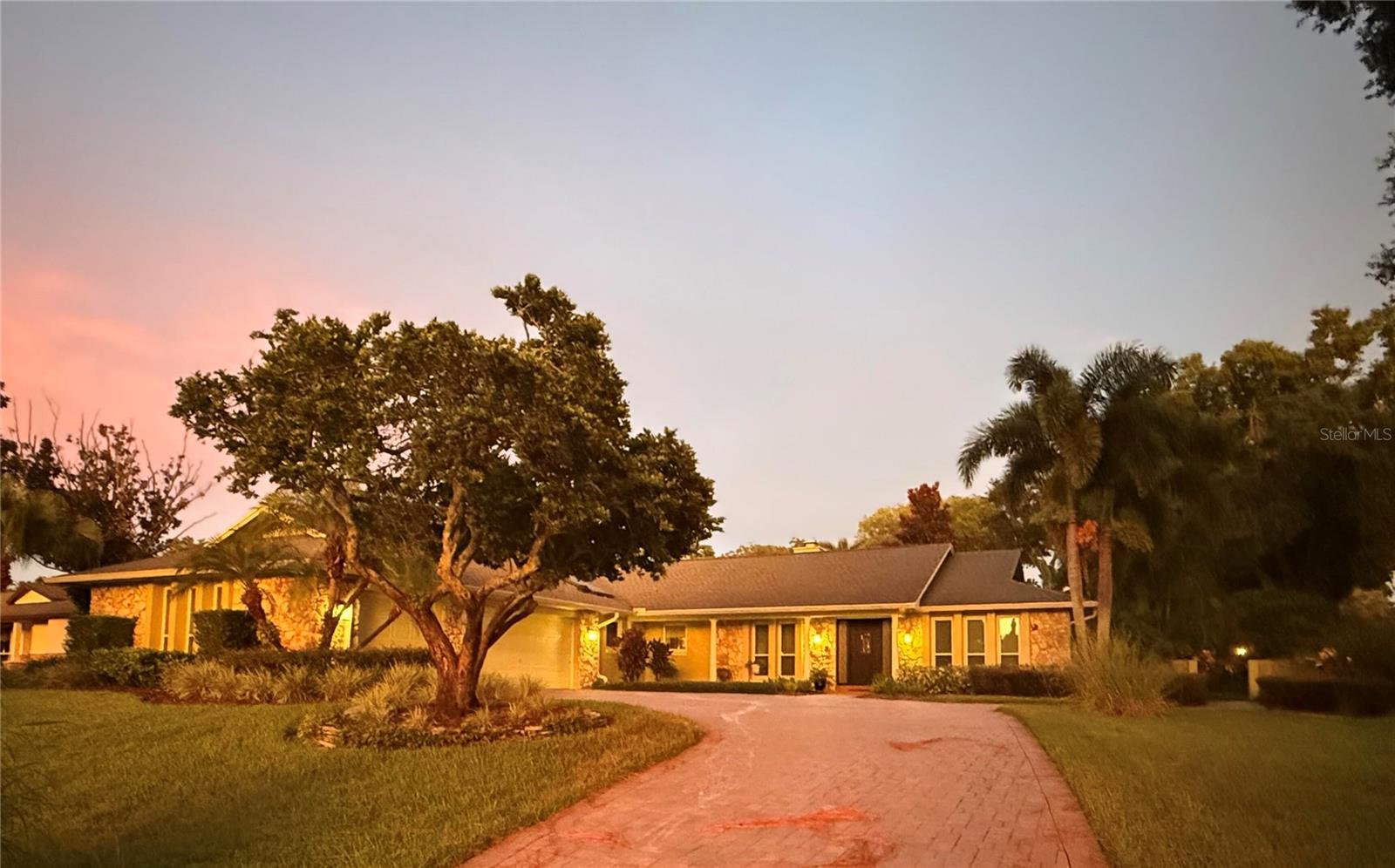 This classic Florida ranch-style home in desirable Bay Hill features a private, beautifully landscaped, park-like back garden. Details include spacious living areas, Brazilian cherry wood floors, fieldstone fireplace, and recently remodeled bathrooms with marble and granite finishes. The kitchen is equipped with high-end appliances and ample counter space, appropriate for cooking enthusiasts. The primary bedroom is spacious and features a large walk-in closet. Two additional bedrooms are spacious and carpeted with Berber. Roof, two new A/C units, solar panels and solar water heater offset energy costs and are less than 5 years old. The 3-car garage provides comfortable two-vehicle parking, ample workspace, and a 3rd bay for golf-cart, compact vehicle or lawn equipment.
The Bay Hill neighborhood is home to the Bay Hill Club and Arnold Palmer Invitational golf tournament. Ownership includes deeded access to Lake Tibet and adjoins the Butler Chain of Lakes.