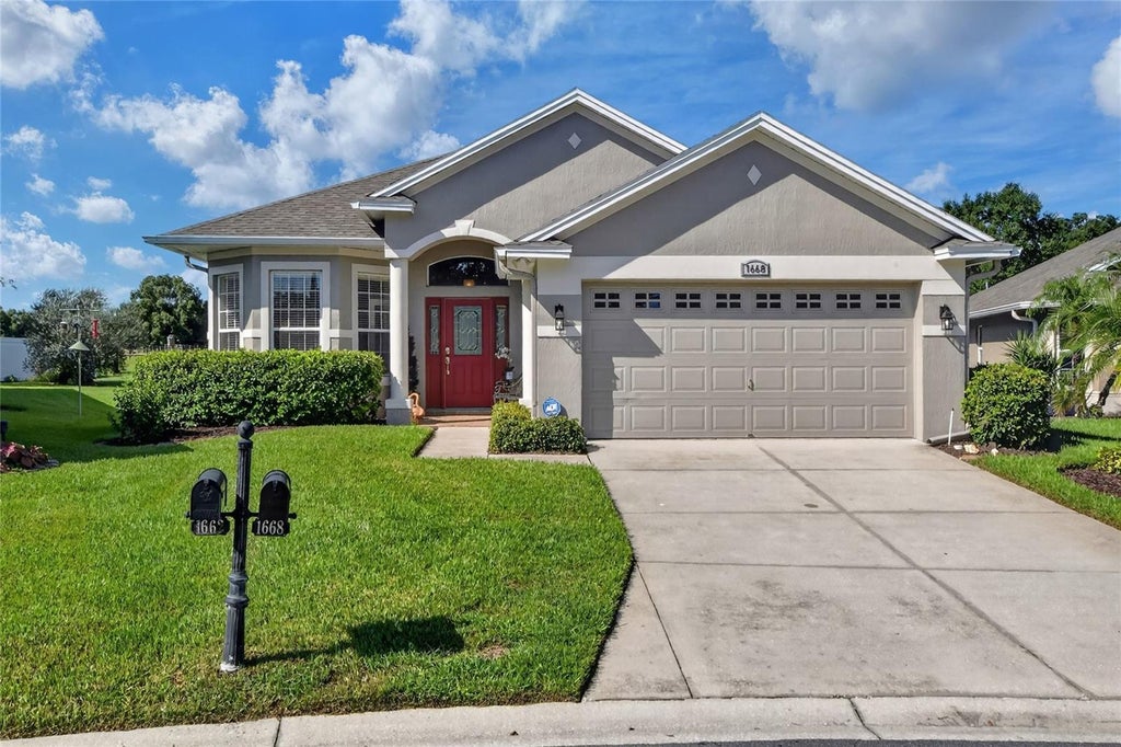 Photo of 1668 Rocky Pointe Drive, Lakeland, FL 33813 (MLS # O6440777)