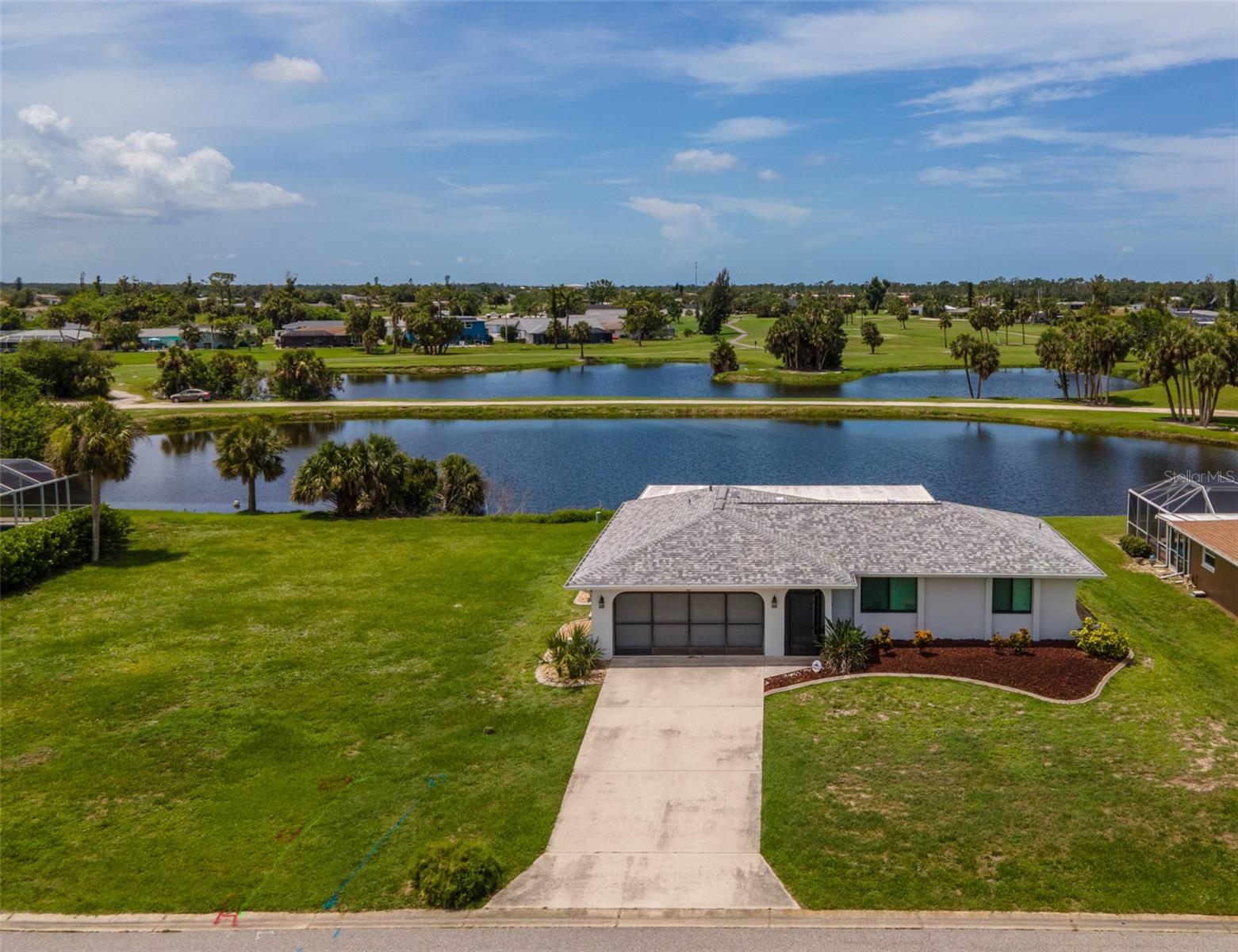 Serenity abounds with this WATERFRONT home on a DOUBLE LOT in Rotonda West! This beautifully maintained Rotonda West home offers the perfect blend of peaceful living and spacious comfort. Imagine sipping your morning coffee in the EXPANSIVE AIR-CONDITIONED FLORIDA ROOM, overlooking a serene pond with no rear neighbors, a truly private and calming escape from the everyday hustle. ***Step inside to discover a thoughtfully designed floorplan ideal for entertaining and everyday living. The main living area invites you to relax and unwind, while the flexible Family Room serves as the perfect canvas for your lifestyle. Have a movie space, office or hobby room. At the heart of the home lies a bright and functional kitchen, featuring a breakfast bar and easy flow to both the dining room and Florida room—making meal prep and hosting effortless. ~~~Retreat to your generous primary suite, complete with a WALK-IN CLOSET, abundant natural light, and an en-suite bath for privacy and comfort. Your guests will feel right at home in the separate guest bedroom, conveniently located across the SPLIT FLOORPLAN with their own full bath. ***The Florida room, with full air conditioning, provides year-round enjoyment and endless possibilities, whether you're curling up with a good book, hosting friends for sunset cocktails, or simply taking in the peaceful pond views. ~~~Practical features abound, including an INDOOR LAUNDRY room, SCREENED GARAGE perfect for hobbies or relaxing evenings, a NEW ROOF (2023), and hurricane IMPACT WINDOWS for your peace of mind. ***Located in a quiet neighborhood close to shops, dining, and schools, this home blends comfort, convenience, and nature’s beauty perfectly! Take a short drive to Englewood and Manasota Beaches, Boca Grande, world class fishing and boating and more. Call now to schedule a showing. Don’t miss the opportunity to own this peaceful retreat and start living the Florida lifestyle you’ve been dreaming of!