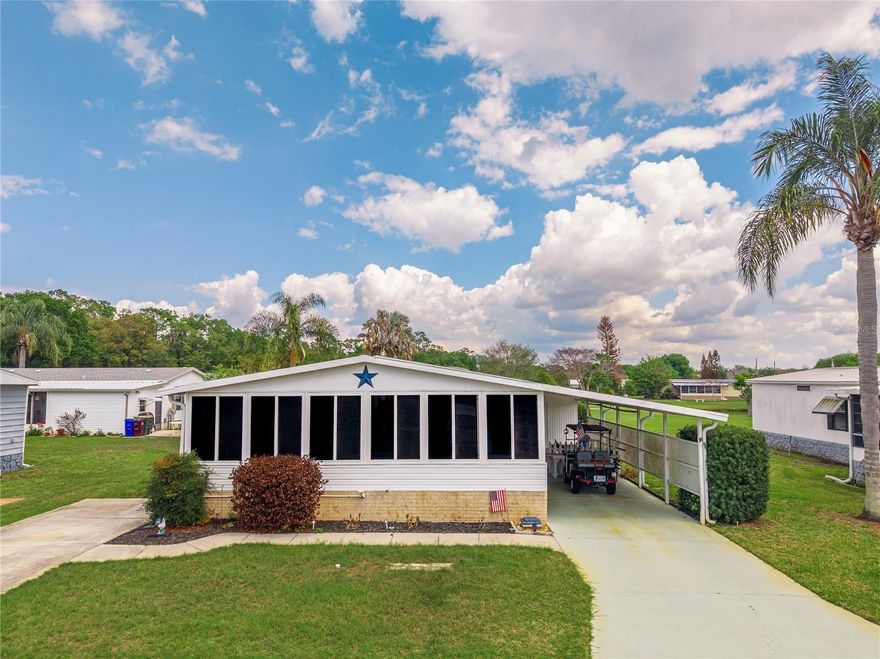 WATER VIEW.......located in TEKA VILLAGE, a great 55+ GATED community. TWO driveways, a 12x45 3-CAR CARPORT and TWO FLORIDA ROOMS/PORCHES!!  The front Florida Room has GLASS WINDOWS......and rear Florida Room has SCREEN and VINYL WINDOWS.  Our Kitchen has been REMODELED.....new cabinets with QUARTZ counters. Stainless Steel appliances will convey, breakfast bar is great for snacking, Lazy Susan makes storage easy, and a built-in storage nook adds extra space.  ROOF WAS REPLACED IN 2019, home was REPIPED IN 2021, both baths have updates......lots of natural ambiance to include a skylight. The Owner's Suite has a private bath and personal access to the back patio. Tranquil pond panorama from this back patio......enjoy coffee and watch the sunrise over the water.  A secondary rear patio gives opportunity for BBQ cook-outs. In addition to the HUGE CARPORT, we also have an 11x11 utility building that houses the washer & dryer, spare fridge, and lawn tools.  With shelving & benches, it's a superb place to tinker, storing the bikes or holiday totes.  Lamp post & flagpole adorn the front yard......plenty of space to park, situate the golf cart, & have guests over.  HOA is very reasonable at $110 monthly......includes an INSIDE POOL, a CLUBHOUSE, small GYM, SHUFFLEBOARD COURTS, a POND DECK, & an RV/CAMPER or BOAT PARKING yard!!!!  Reach the OIA in 20+ miles, Melbourne Beach in 53+ miles, downtown St. Cloud in 4+ miles, or Lake Nona in 26+ miles.  St. Cloud offers beautiful lakes for boating or fishing.....a lakefront park for volleyball or July 4th fireworks......and local farms for fresh produce.  Come be a part of this 55+ community.....own the land.....partake in fun activities at the clubhouse......and enjoy a friendly atmosphere!!   SMALL 'JOHN' BOAT IS FOR SALE SEPARATELY.