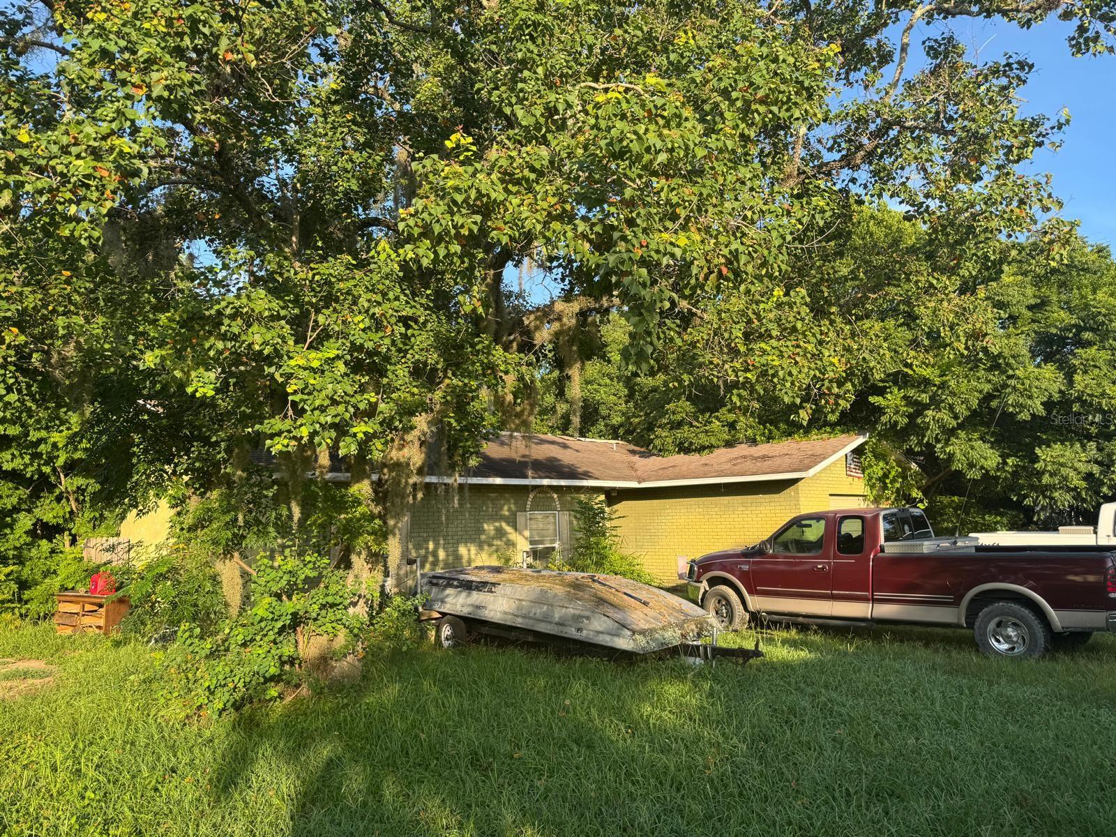 Needs TLC great for an investor to renovate. This charming 3-bedroom, 2-bath residence offers comfortable single-story living with 1,348 sqft of well-laid-out space. It features an attached garage for convenience and valuable kitchen essentials like range, oven, and refrigerator already included. Situated on a .27-acre lot, the home offers privacy and potential outdoor enjoyment. With tile flooring throughout and built in 1979, it’s a blend of upkeep and simplicity.