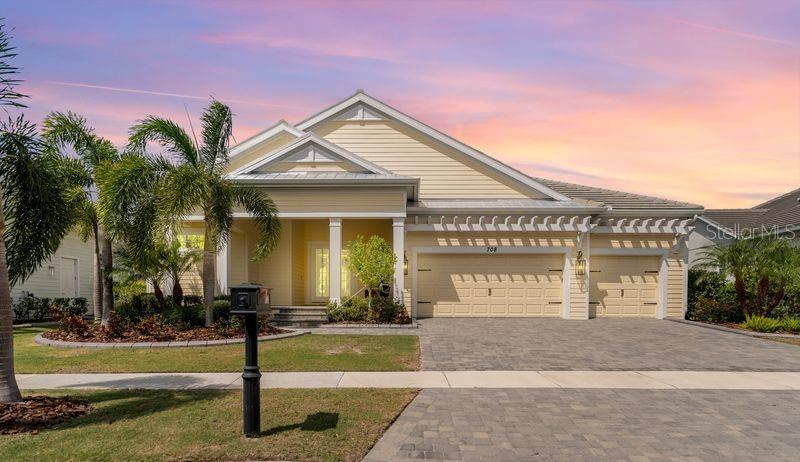 EXCEPTIONAL POOL HOME ON A SERENE PRESERVE OASIS IN THE EXCLUSIVE MIRABAY GATED COMMUNITY. Welcome to this magnificent single-family residence built in 2020, located in the highly sought-after Mirabay community, where every day feels like a weekend retreat. Mirabay is a private, waterfront community offering an array of top-tier amenities, including a fitness center, resort-style pool with a waterslide, lap pool, kids splash fountain, Poolside Café, tennis courts, pickleball courts, basketball courts, parks, playgrounds, kayaking, fishing, community boat ramp, and a boat lift for easy access to Tampa Bay. This stunning residence is packed with luxurious features and upgrades that elevate the living experience. Upon entering, you’ll be greeted by an elegant foyer showcasing a chic shiplap wall and upgraded lighting. The spacious open-concept layout connects the soaring living room to the chef’s kitchen and dining area. The living room boasts panoramic views of the preserve, offering a peaceful natural backdrop that can be enjoyed year-round through zero-corner sliders with air curtains that keep out any flying insects, dust, fumes and the indoor temperature just right while you embrace the outdoors. The gourmet kitchen is designed for both cooking and entertaining, featuring a gas range with a stylish hood, top-of-the-line stainless steel appliances, and overhead lighting above the island for cooking workspace. A built-in pantry ensures all your culinary essentials are neatly stored. Step outside to discover an expansive indoor/outdoor living area, perfect for enjoying Florida’s year-round beauty. The custom-designed pool includes a swim-up cocktail table and a Baja Sun Shelf, ideal for lounging or playing. On cooler evenings, warm up in the attached spa, complete with two gas-powered stone fire bowls. The outdoor kitchen is a chef's dream, outfitted with a custom bar, built-in gas grill, overhead vent, beer taps, ice machine, beverage fridge, and an outdoor sink. Entertaining here is effortless, with ample space for dining and lounging by the pool. The panoramic pool enclosure offers unobstructed views of beautifully landscaped gardens leading to a lush nature preserve. Inside, the luxurious primary suite features a mini split-unit AC system for personalized comfort. His and her closets are equipped with custom shelving to ensure plenty of storage. The primary bathroom includes elegant stone counters, a vanity space, walk-in shower with a built-in bench, and is pre-plumbed for a bathtub. Two additional bedrooms each have their own en-suite bathrooms, accentuated by unique design elements, including a charming shiplap wall in one and a stunning stacked stone wall in the other. For those working remotely, a private office/study with a murphy bed provides the perfect space for productivity and extra guests. This home also includes a wealth of modern upgrades and thoughtful details, such as solar panels for energy efficiency, a Trimlight system for customizable exterior lighting (perfect for seasonal holidays), an upgraded epoxy garage floor, a fully retractable garage screen with door, customized concrete landscape borders, a water softener, enhanced irrigation system, ladder and loft storage for easy access, and a Tesla charger for electric vehicle owners. Indulge in the unparalleled luxury and amenities that this home and the Mirabay community offer. Schedule your private showing today and experience elevated living at its finest!