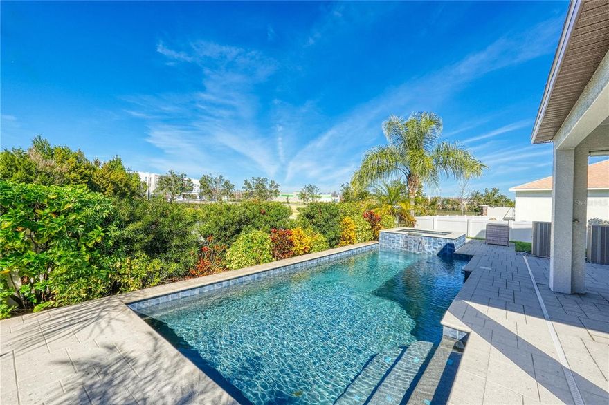 Welcome to this beautifully well maintained two-story home located in the desirable gated community of The Villages of Trinity Lakes. Featuring a well appointed kitchen with beautiful quartz countertops, lots of cabinets, a walk-in pantry and dinning area. Upstairs, 4 bedrooms, including the primary suite, complete with a primary bathroom featuring quartz counter tops, dual sinks, shower and a spacious walk in closet. Also an spacious den, perfect for a play area. Downstairs a bonus room that can easily serve as a 5th bedroom, home office, or media room. Enjoy Florida living on your own private, heated saltwater pool and spa, perfect for year-round relaxation and entertaining. Low HOA and no CDD fees, a rare find in this area. The Paved Suncoast Trail, Jay B. Starkey Wilderness Park, provide miles of trails for walks, bike rides, roller blading, while enjoying scenic Florida wilderness. Conveniently located and with access to major roads, making commute to Tampa International Airport, or the Gulf beaches a breeze. Schedule your private showing today.