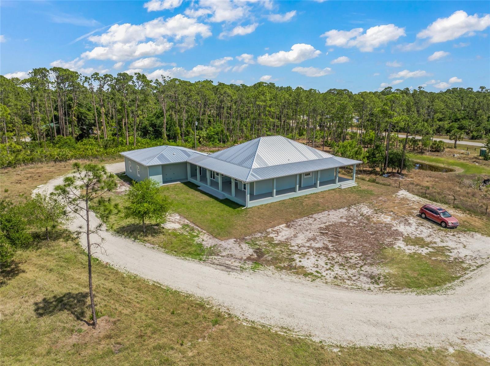 Under Construction. OPPORTUNITY OF A LIFETIME IN NORTH PORT, FL - WHERE LUXURY LIVING MEETS LIMITLESS COMMERCIAL POTENTIAL!
Step into a world of boundless opportunity and unmatched craftsmanship with this newly constructed estate set on 13.83 pristine, multi-use acres in booming North Port, Florida. Whether you're seeking a luxurious private retreat, an income-generating agricultural powerhouse, or a commercial base of operations with unmatched infrastructure—this property delivers on every front.
A TURN-KEY INVESTMENT DESIGNED TO GENERATE RETURNS
This isn’t just land—it’s a fully functioning, USDA-certified farm, nursery, and landscaping business with top-tier infrastructure already in place. With $500,000 in engineered fill, the elevation sits high and dry at 24', ensuring peace of mind and long-term stability. The entire acreage is equipped with: Three high-capacity water wells, each with independent reverse osmosis systems. Full irrigation throughout the property. Comprehensive electrical service and a modern septic system.
LUXURY MEETS FUNCTION: The Residence
Live where you work—or simply live in luxury. The newly built 3-bedroom, 3.5-bath residence was constructed to withstand Florida’s fiercest storms, with resilience and elegance in every detail. The home features: A massive 40’ x 45’ 3-stall garage with a dedicated half bath—perfect for oversized vehicles, equipment, or workshop space, modern interiors built with expansion in mind— home could be easily converted to a club house, office or AirBnB, ready for your custom outdoor entertaining area (plumbing and electrical in place), high-end finishes and smart infrastructure offering both comfort and confidence.
THREE PARCELS, ENDLESS POSSIBILITIES
This property includes three separate parcels (ID #'s: 0948-01--0224; 0948-01-0225; 0948-01-0226), zoned AG—allowing for wide-ranging residential and commercial uses. Its rare non-deed-restricted status gives you the flexibility to pursue your boldest ambitions without red tape.
STRATEGIC LOCATION FOR GROWTH
Located just 3.7 miles from the I-75 interchange and the upcoming, Sarasota Memorial Hospital, this prime location ensures convenient access for commercial vehicles, clients, and suppliers. It's the perfect headquarters for:
A landscape and turf management company, A residential development or equestrian estate, An Agri-tourism venture, A Growers transfer station, Grow a specific crop, continue as is with the nursery and many more... Or your own vision—from riding stables to private retreats
AN INVESTMENT IN LIFESTYLE AND LEGACY
With infrastructure, business certification, and premium construction already completed, this property offers immediate usability and long-term value. Whether you're a seasoned investor, entrepreneur, or visionary looking to build your dream homestead, the foundation is already laid for something truly exceptional. Don’t just buy land. Acquire a future. Secure your stake in North Port’s promising landscape—schedule your private viewing today and prepare to be inspired. This property isn’t just worth every penny—it’s a rare and strategic investment in lifestyle, growth, and opportunity.