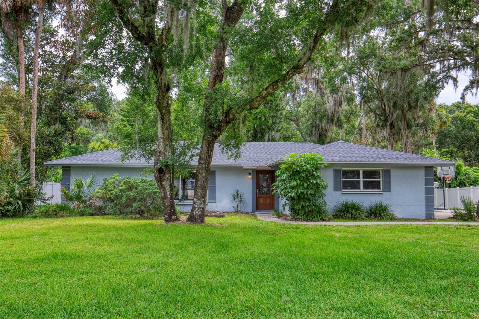 One or more photo(s) has been virtually staged. Located in the highly sought-after neighborhood of Tomoka Oaks and nestled on a sprawling, almost 1/2 an acre lot, this unique 4-bedroom, 2-bathroom home embodies the perfect blend of comfort and charm. As you step inside, you'll immediately be captivated by the abundance of natural light that infuses each spacious room with warmth and brightness. The thoughtfully designed split-floor plan ensures privacy for everyone, making it ideal for families or those who love to entertain. The heart of this home is undoubtedly the expansive sunroom — a true space where you can relax or host gatherings while overlooking your enormous yard. Picture summer barbecues under the stars or serene moments sipping coffee as you take in the lush landscape that surrounds you. Outside, enjoy unmatched tranquility and seclusion within your expansive backyard; it's your canvas for gardening opportunities and outdoor activities galore. Imagine creating lasting memories, whether it's an afternoon playing catch .setting up a fire pit for cozy evening chats, or simply lounging in nature's embrace. With solid bones and a great space, all this home needs are a few custom touches to truly make it your own. Whether you're looking to settle in or invest in a home with potential, this one is worth a look. (Things to note: Roof 2024, A/C 2012, Hot Water Heater: 2008). Square footage received from tax rolls. All information recorded in the MLS intended to be accurate but cannot be guaranteed.