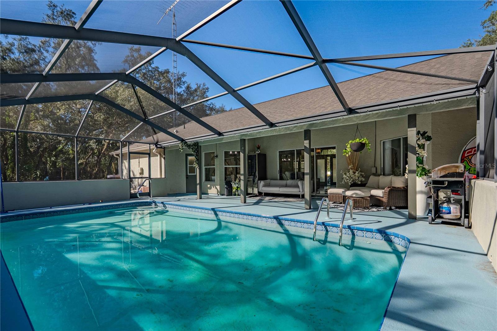 Remarkable 3BR/2BA/2-Car Garage POOL HOME with spectacular 1+ Acre Lot in tranquil Weeki Wachee!!  This extravagant home features a spacious open floor plan with plenty of room to relax or entertain (indoors or out)!! From the moment you walk through the double door entrance the breathtaking ceiling height and magnificent floors lead through the formal living/dining spaces into the gourmet kitchen with breakfast nook, tons of counter space, cabinet storage, and stainless steel appliances that will please your family chef. The master suite features tremendous space with a luxurious master bath that has a soaking tub, oversized shower, dual vanities and sinks plus gorgeous lighting throughout. This home is truly one-of-a-kind and should not be missed! Call now to schedule your showing and make this beauty your own today!!