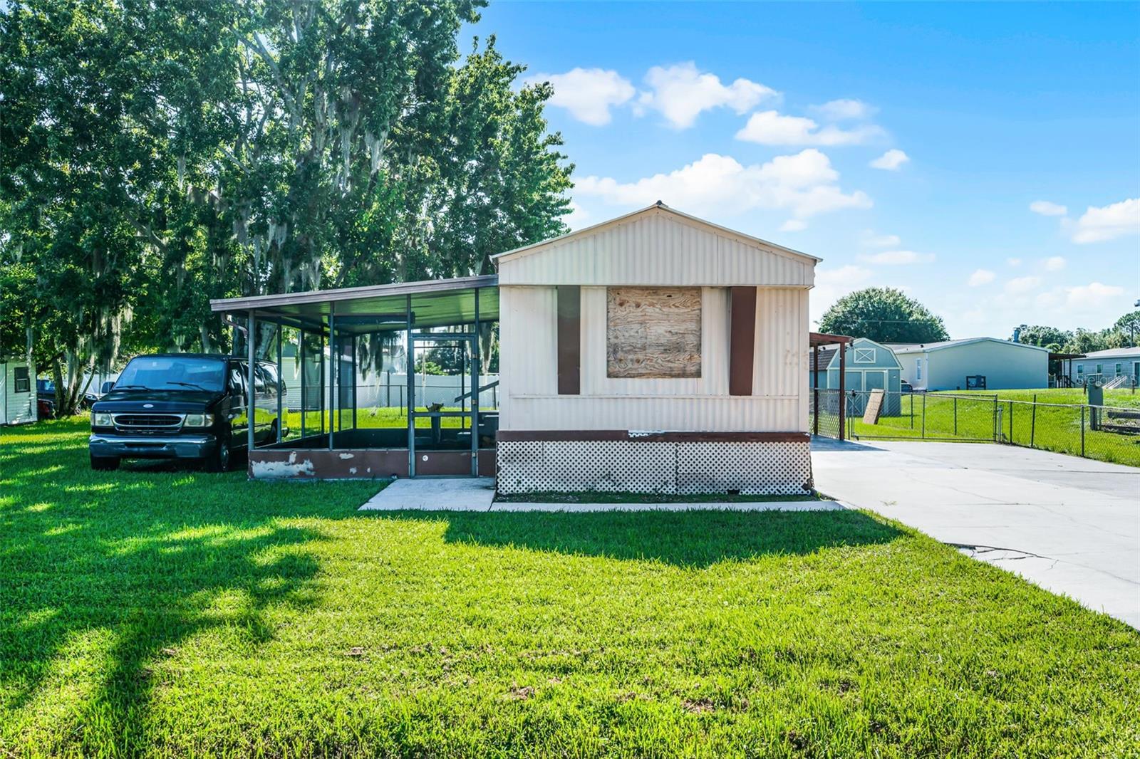 Discover affordable comfort in this 3-bedroom, 2-bathroom single-wide manufactured home, perfectly situated on a spacious 0.25-acre lot with no HOA. Step inside to an open-concept living area and kitchen, ideal for both everyday living and entertaining. Enjoy Florida living year-round from the screened back patio overlooking your private yard. Conveniently located just minutes from Kissimmee Executive Airport, The Loop shopping and entertainment complex, a variety of restaurants and marketplaces, and only 12 miles from the magic of Walt Disney World. Whether you’re looking for a primary residence or an investment opportunity, this property offers both value and location.