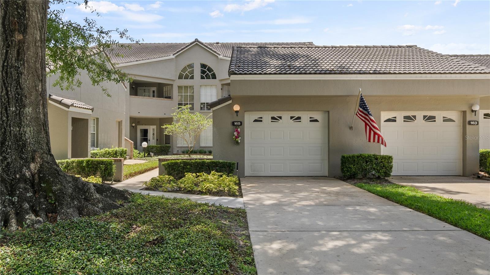 Discover this move-in ready 2-bedroom, 2-bath second-floor condo located in the highly sought-after Wekiva Hunt Club community in Longwood. Built in 1994 and featuring 1,427 square feet of well-designed living space, this home offers comfort, style, and scenic views of the neighboring golf course. The spacious split floor plan includes a bright living and dining area with a cozy wood-burning fireplace and a built-in dry bar—perfect for entertaining. Step out onto the enclosed back patio, which includes its own HVAC system, providing a comfortable space to relax year-round. This home has been well maintained with key updates, including a full building replumb in 2022. You'll also enjoy the convenience of a detached garage, additional driveway parking, and generous storage options. Community amenities include a sparkling pool, lawn care, exterior maintenance, and cable TV—all covered by the HOA. Nestled just minutes from Wekiva Springs State Park, shopping, dining, golf courses, and major highways, this home offers a peaceful retreat with easy access to everything you need. Don’t miss this rare opportunity to live in one of Longwood’s most desirable neighborhoods!