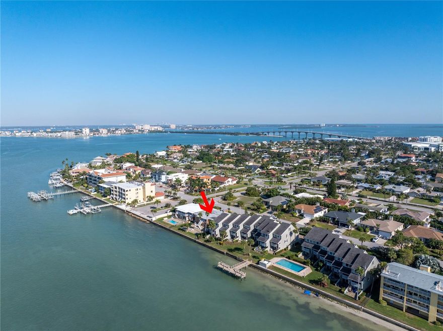 STUNNING WATERFRONT VIEW OF THE PASS-A-GRILLE CHANNEL. Beautifully updated 2 BED 2 BATH Tierra Verde Waterfront condo you have been dreaming of is available. 1315 TOTAl SQFT with a Florida room-with-a-view you will never tire of. EASY ACCESS, GROUND FLOOR, NO STAIRS!! This well maintained 7-unit complex is nestled in the desirable Tierra Verde Island community featuring the stunning nature of 1,100 ACRE Ft. Desoto Park and a whole host of restaurants, bars and community conveniences on your doorstep. Walk through the front door and you will be impressed by all the interior updates and of course the breathtaking views of the Pass-A-Grille channel. All finishes were completed by the current owner and are  recent; ranging from June 2020 to the present date. Everything from stunning NuCore Performance Waterproof floors THROUGHOUT, the gorgeous kitchen with steel finish appliances, KraftMaid cabinetry, Ferguson touchless bronze finish faucets, Cambria Quartz countertops, a wine fridge…the list goes on. With added intricate detail to landscaping, you will not be disappointed as you drive into your 2 CAR brick paved partially covered carport. As you walk through this gorgeous ground floor condo you’ll be drawn to the peace and serenity of these breathtaking views of the Pass-A-Grille channel. The sunset views here are the perfect way to end your day in Paradise. Fire up the grill and enjoy your oversized brick paved patio as you watch the boaters, birds, manatees and dolphins travel across your backyard. You’ll also be just steps away from the cool and refreshing pool; it’s a mere hop-skip-jump from your ARMORVUE DEEP POCKET HURRICANE-PROOF SLIDING BACK DOORS with custom made blinds. BRAND NEW ROOF, EXTERIOR PAINT,  AC, LANDSCAPING, GUTTERS, POOL RESURFACE AND MISCELLANEOUS POOL EQUIPMENT - ALL 2025. Tierra Verde has its own Downtown with Restaurants, travel agency, nearby tennis courts, baseball field and playground. It’s a great spot for getting around too as vibrant Downtown St. Petersburg's only 10 minutes away, Tampa International Airport 25 minutes and Orlando is less than 2 hours.