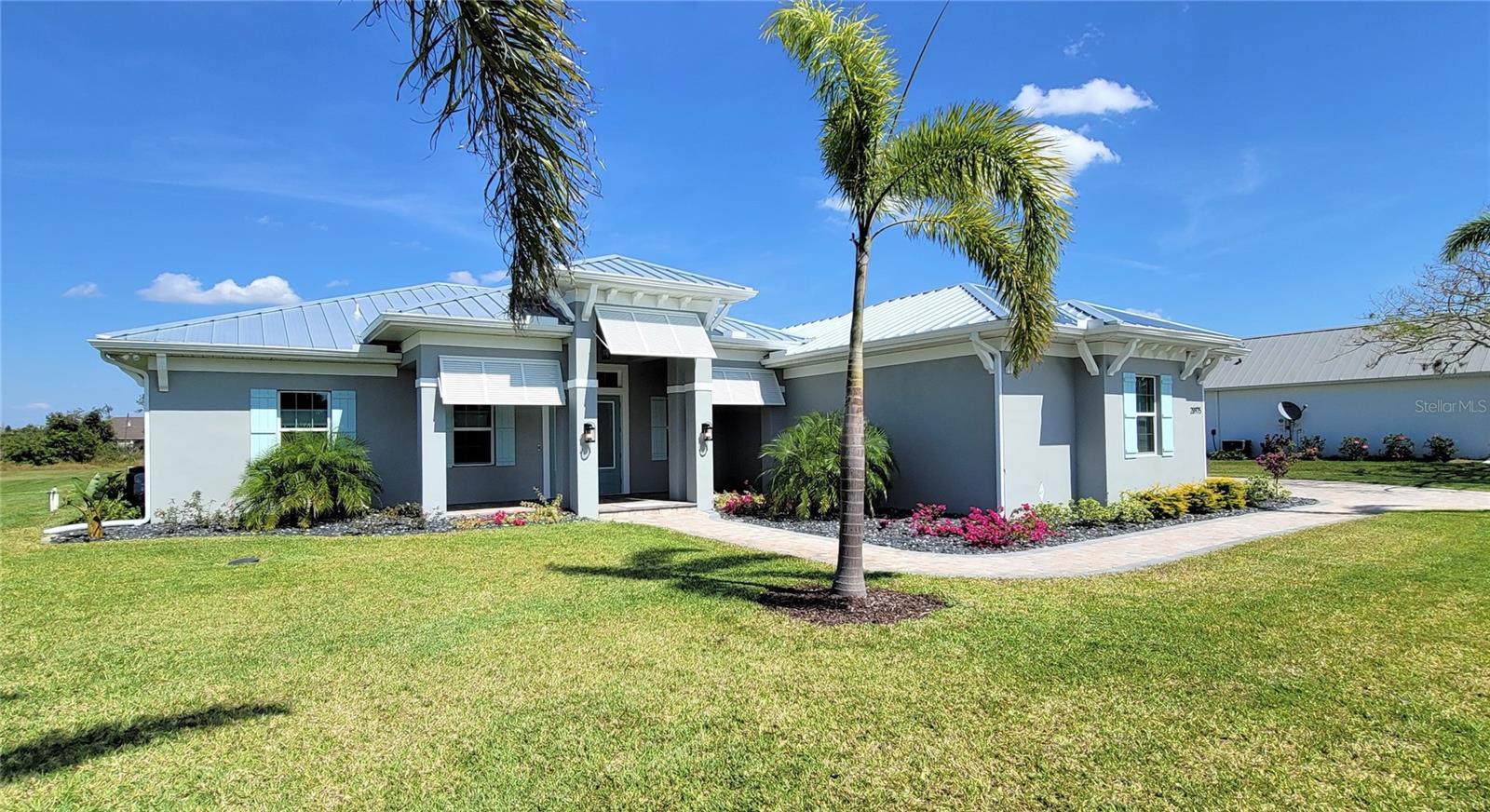 **RECENT PRICE IMPROVEMENT**PLEASE ENJOY THE 3D INTERACTIVE VIRTUAL TOUR ASSOCIATED WITH THIS FABULOUS LISTING – Welcome home to the quaint, gated community of the Estates on Peace River! This beautifully appointed executive home was constructed in 2022 for these original owners with an eye on detail, design and functionality. Situated on a 1.1-acre parcel, with frontage on a semi-private community pond, this home is feature-rich in every way. With 2586~ square feet of living space, this gem has more upgrades than can be outlined here. Some of the key features include four spacious bedrooms, three full bathrooms, a private den/office with French glass doors, impact windows, an oversized side entrance three-car garage with a large paver stone driveway, an ultra-durable 24-gauge metal roof, a 22-kilowatt whole-house generator with a 500-gallon in-ground propane tank and a private 60x30 foot multi-purpose lit sports court to enjoy pickleball, basketball or tennis, day or night! On the inside, an enviable open kitchen awaits, with stunning quartz counters complimented by a decorative backsplash, more than ample wood cabinetry, double ovens, a spacious concealed pantry and a wine cooler! All of which overlook an inviting great room with a gas fireplace, tray ceiling and built-in sound system. The split bedroom configuration provides the primary suite, with its enormous walk-through closet and nicely appointed en-suite bath for added privacy. Ten-foot + ceilings and eight-foot doors are the order of the day in this smart home. Except for three carpeted bedrooms, the home has variable-sized porcelain plank flooring. As inviting as the interior space is, the focal point of this home remains the nearly 2100 square foot oasis-like screened and partially roofed rear pool enclosure. This space, accessible from the Great room, Kitchen and Guest wing, enjoys beautiful paver stone decking around the 32x14 foot inground, heated salt-water pool, with an integrated hot tub, lounging platform and water feature. In addition, there is a full and beautifully designed outdoor kitchen with a built-in gas firepit and sound system. The Estates on Peace River is a new gated waterfront community comprised of just 28 1+ acre parcels, each WITH AN ASSIGNED BOAT DOCK on the Peace River, and access to the community boat launch and Tiki Hut pavilion. Architecturally consistent with modern "coastal design," this community offers an old Florida lifestyle while providing ultra-convenient rural living with a very low monthly association fee. The Estates on Peace River has convenient access to all Southwest Florida offers by land or water. From here, you are 1 mile from Charlotte County Emergency Services, 3 miles from shopping, 8 miles from Interstate 75 (exit 164) and 10 miles from historic downtown Punta Gorda and the Punta Gorda Airport (PGD). With your own assigned boat slip, you have access to Charlotte Harbor and the Gulf of Mexico! This is the perfect home in the ideal location! Take a virtual walk-through now by clicking on the link provided; Schedule your in-person showing today and experience the beauty of this unique residence and tranquility of The Estates on Peace River for yourself!