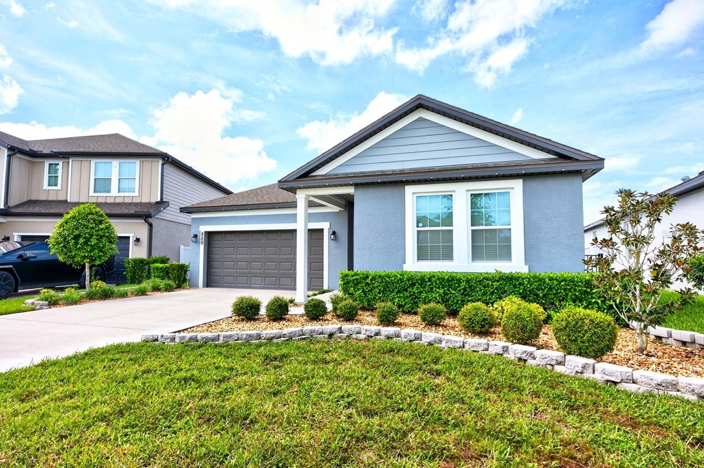 Photo of 880 Livestock Loop, Saint Cloud, FL 34771 (MLS # O6449961)
