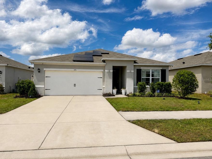 Welcome to your cozy retreat in the desirable Grace Ranch community of Haines City! This well-maintained 3-bedroom, 2-bath home offers a bright open layout designed for comfort and everyday living.
Enjoy a modern kitchen with stainless steel appliances, ample counter space, and an inviting flow into the main living area—perfect for relaxing or entertaining.
Upgrades include solar panels for energy efficiency, a water treatment system, a pergola for outdoor enjoyment, and a fully fenced backyard for added privacy.
Conveniently located near schools,  shopping, dining, and major highways.
A great opportunity to enjoy comfort, convenience, and value in a growing community!