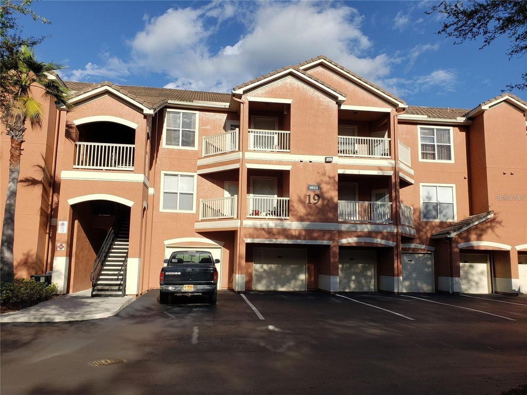 Photo of 8813 Villa View Circle #104, Orlando, FL 32821 (MLS # O6448690)