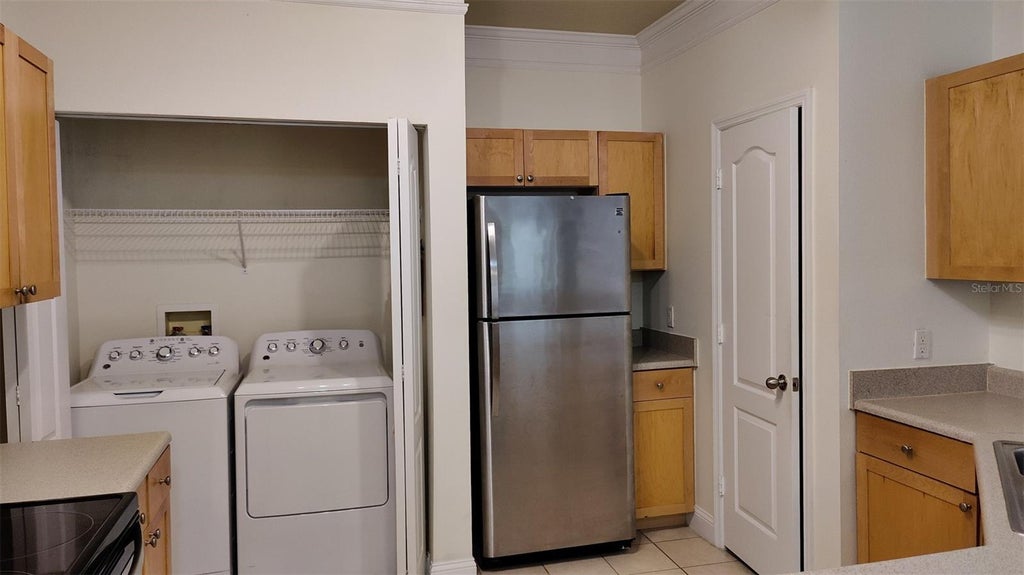 Photo of 8813 Villa View Circle #104, Orlando, FL 32821 (MLS # O6448690)