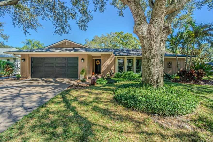This beautiful single-story home in the established neighborhood of Spanish Oaks in Palm Harbor perfectly blends comfort, character, and thoughtful updates throughout.Offering a split floor plan with four bedrooms, three baths, a private office, and a flexible bonus area, this home provides 2,808 square feet of comfortable, beautifully laid-out living space for everyone.Stepping into the foyer there is a large living room to the right and an adjoining additional flex space that could be used as a formal dining room and there is still a large casual dining area with easy access to the kitchen. Just adjacent to the kitchen and family room, you’ll find a flex space that’s perfect for a playroom, bonus room, hobby area, or even a second living space. The large family room features custom shelving and storage, and a custom wood burning fireplace that adds warmth and charm, making it an inviting place to gather. The kitchen is light and bright, completely remodeled in 2023 with a deep stainless steel sink, quartz countertops and Wi-Fi–compatible stainless steel appliances, including a convection oven, microwave, and dishwasher. It’s a space that’s as functional as it is beautiful and ready for casual breakfasts, family dinners, or weekend entertaining. Luxury vinyl plank flooring added in 2022, gives the living room and bedrooms a modern, cohesive feel.The updates continue with a new roof, and gutters in 2023, plus the flat roof has added insulation for lower electric bills. The 3E 18 SEER Air-Com AC system, installed in 2024, comes with a Wi-Fi thermostat and UV light to provide air purification throughout the whole home ensuring clean air with energy efficiency all year long. A 10 year warranty on parts is the icing on the cake. A water softener was added in 2024.The entire house was re-piped in 2021, and that same year, the yard was completely fenced with two access gates.The backyard is a private oasis, featuring artificial turf, a koi pond, rain barrels that hold 220 gallons of water, and peaceful sitting areas—perfect for morning coffee or evening get-togethers.The two sheds in the backyard convey with the home for even more storage space.Other updates:pavered driveway, impact resistant windows, newer interior and garage service doors, and a transferable Massey Sentricon system. And of course, location matters. Spanish Oaks is one of Palm Harbor’s most established and desirable neighborhoods and has a community Winter Festival. This home is zoned for A-rated Palm Harbor University High School—one of the area’s top choices for families. From the curb appeal to the smart upgrades and tranquil outdoor living spaces, this home is truly move-in ready and full of warmth and personality. It’s the kind of home where every update has been thoughtfully made, so all you have to do is move in and start enjoying.Nestled along Florida’s beautiful Gulf Coast, Palm Harbor is a highly desirable community known for its small-town charm, top-rated schools, and unbeatable location.Just minutes (approximately 5 miles) from the white-sand beaches of Honeymoon Island, Dunedin Causeway, and Caladesi State Park, this is a relaxed coastal lifestyle with easy access to Tampa, Clearwater, 15 miles to Clearwater Beach, and St. Petersburg.The area features picturesque neighborhoods, scenic parks, and a lively downtown filled with local shops, cafés, and numerous community events.Outdoor enthusiasts love the nearby Pinellas Trail and countless recreation options.