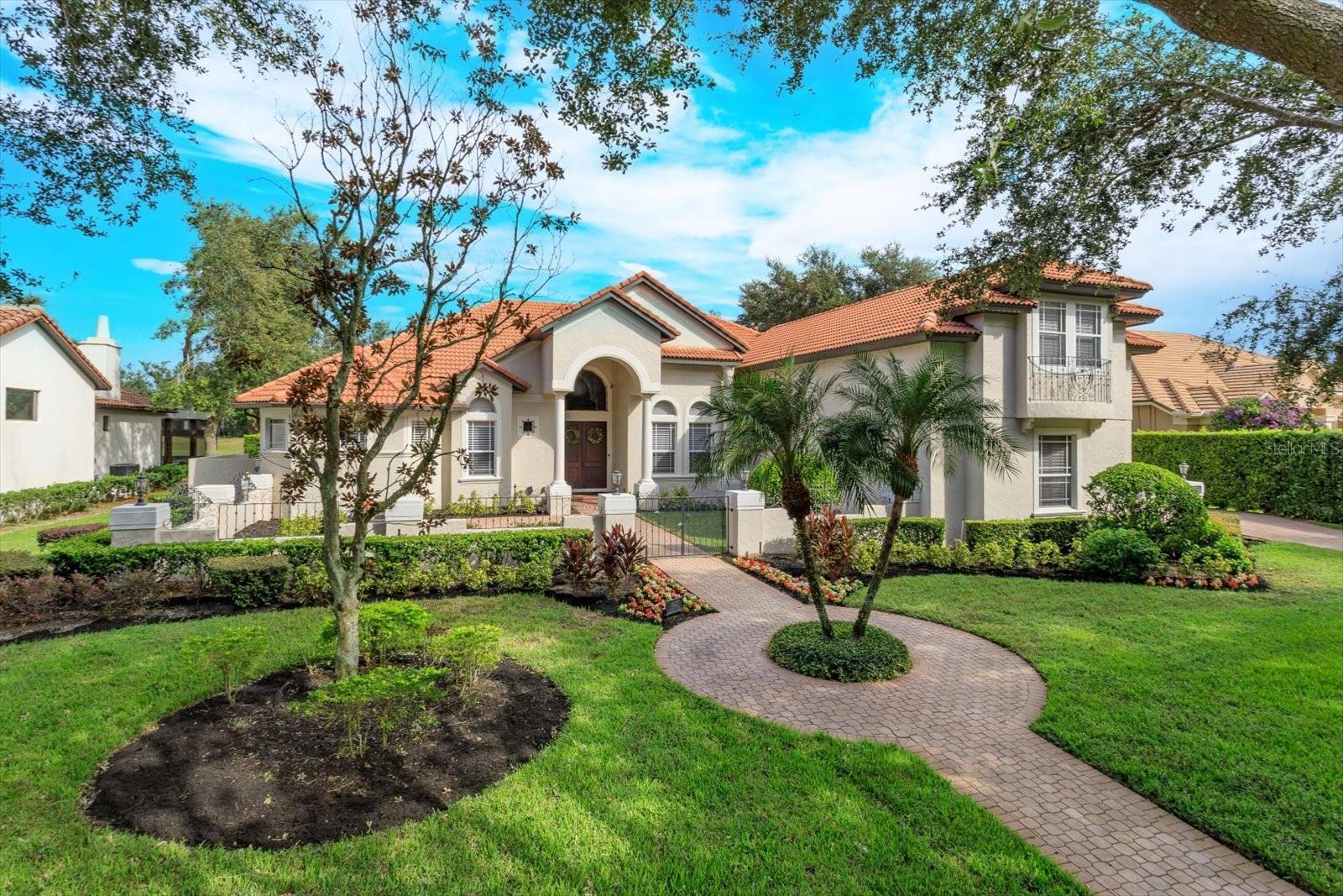 This amazing residence in Keene’s Pointe overlooking the picturesque 4th fairway of the Golden Bear Club has everything you could want or need in a custom home. This flexible floorpan allows the home to be a 6 bedroom with an office, or a 5 bedroom home with two offices. And even beyond that flexibility, you do have 5 full bathrooms, an upstairs suite that is like its own apartment with bedroom, full bathroom, family room, and home theater. Along with a 3 car garage with three electric car charging stations and beautiful epoxy floors. The home has been updated in so many areas since 2020 which include an updated kitchen, fresh interior paint, new movie theater equipment, salt water pool and spa equipment, water heater, AC, and many more. Expansive wood beams run throughout the home on its 12 foot ceilings giving it a grand feel as you move from open room to room with lots of natural light coming into the house from every direction. Outside you will enjoy the Florida lifestyle with an oversized heated pool and spa, along with a full summer kitchen with natural gas grill, professional grade hood, beverage refrigerator, sink, and warming drawer. As far as the community itself, Keene’s Pointe allows for a life like no other with lakes, parks, resident only docks, playgrounds, and of course the world famous Golden Bear Club.