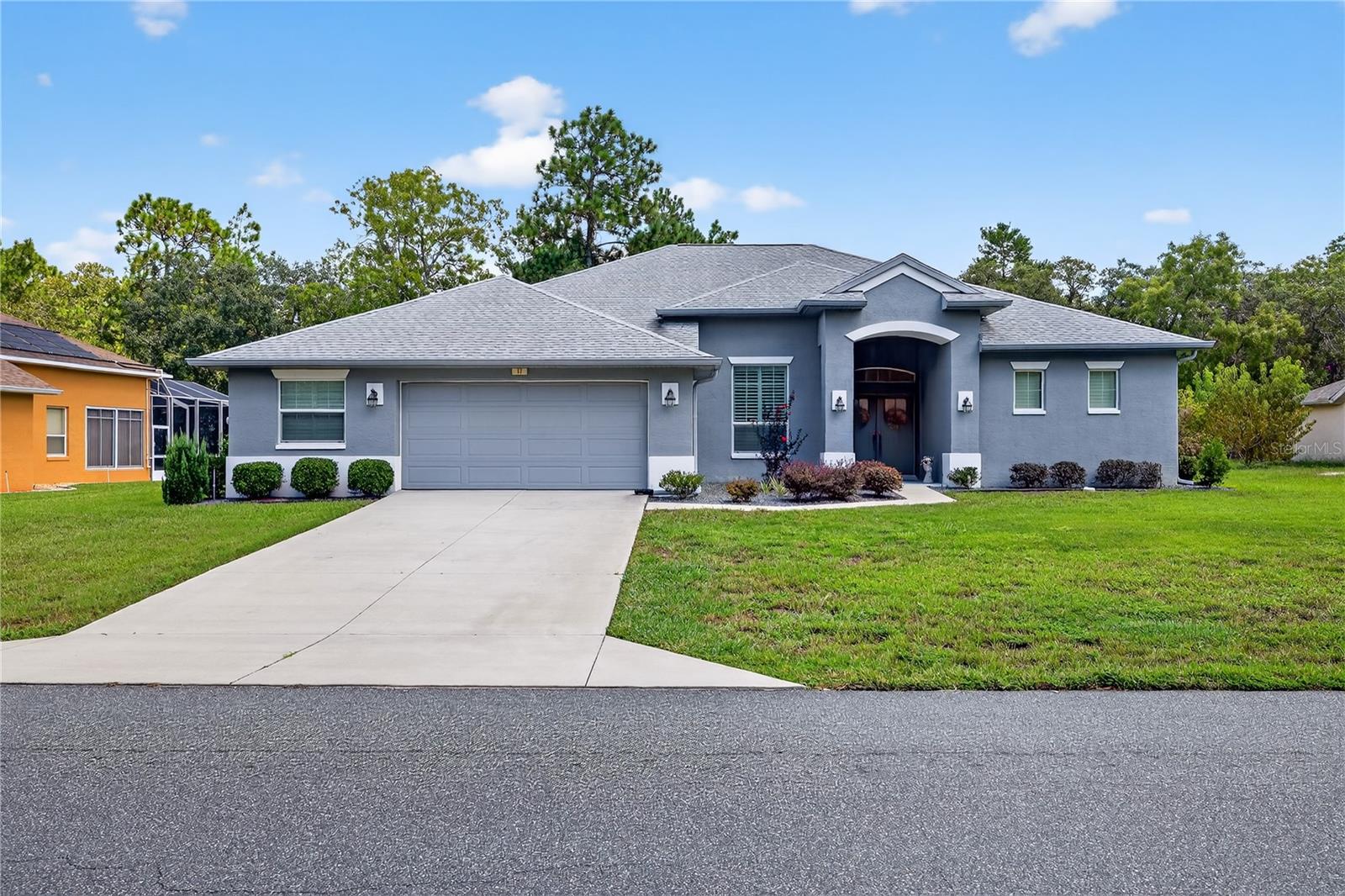 Absolutely stunning & custom-built 3 bedroom/ 2 bath/ 3-car garage, 2020-build home with over 2,050 square feet of open concept living within a split floor plan. The interior of this Sugarmill Woods home boasts lots of natural light with vaulted, trey-ceilings and custom plantation shutters & motorized window treatments throughout. Gorgeous black-stainless appliances, quartz countertops and a butler's pantry accent a dream kitchen/ bar- perfect for any chef or for entertaining! The master suite is sure to impress even the most discerning homeowner- equipped with a walk-in closet, double vanity, custom tub and a walk-in shower- and has a private door leading to the rear lanai and a jacuzzi hot tub. Luxury vinyl flooring covers the home, with a large office/den located off of the living room. There is a large workshop area within the 3-car garage, perfect for projects! Furniture is negotiable. Location is a short drive to the Suncoast Parkway- perfect for an easy commute to Tampa. Enjoy some of Florida's most stunning natural attractions- including Crystal River and Homosassa Springs- just minutes away! The Sugarmill Woods community also boasts some very attractive golf, recreation and country club options!