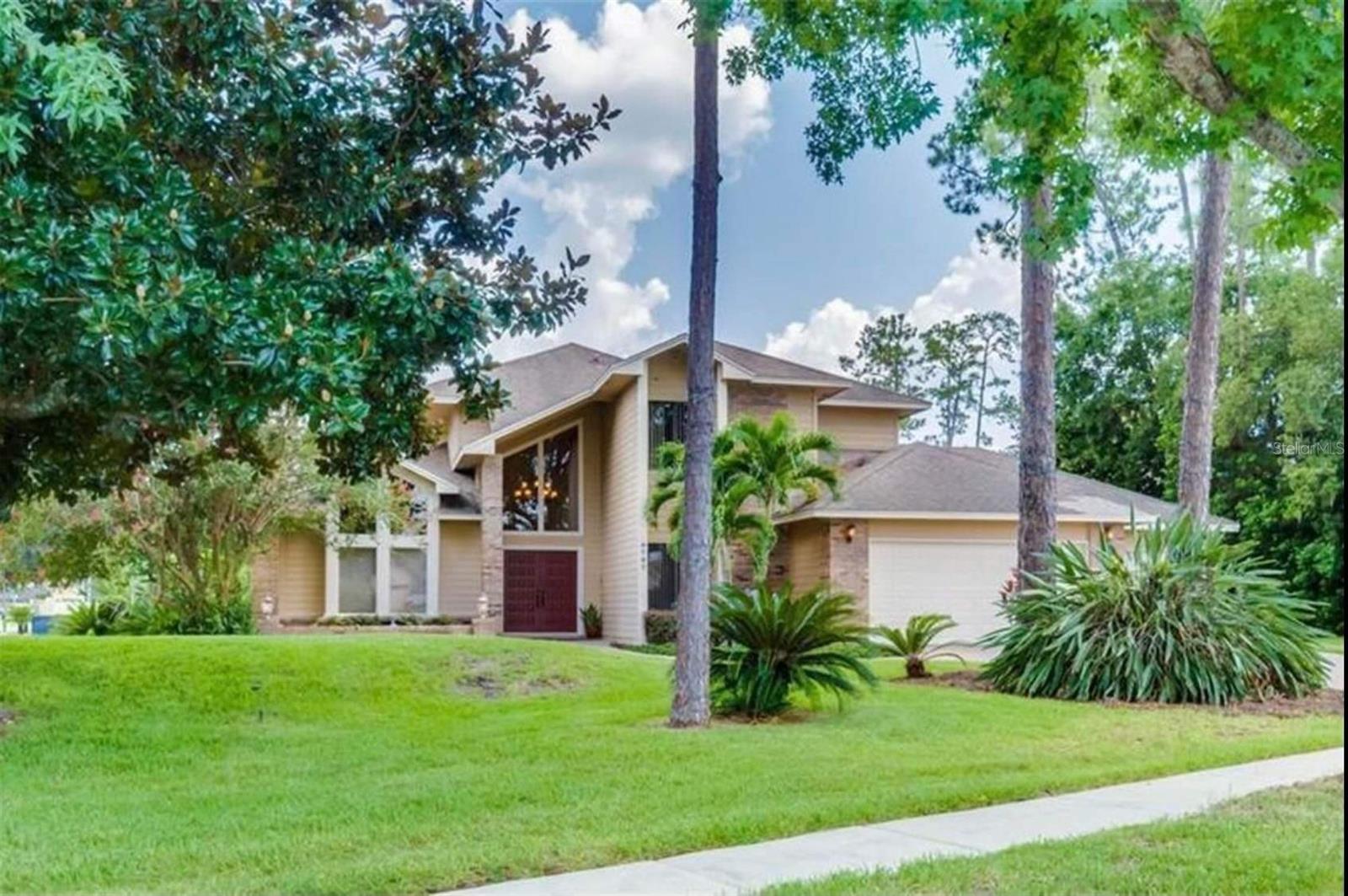 This custom built Home home located in Dr Phillips Bay Vista Estates is situated on an oversized corner lot and is impressive at every turn! From the moment you enter the double front doors you will see a beautiful curved staircase and formal living room with a brick wood-burning fireplace. The covered, screen, enclosed lanai with oversized pool and spa is a retreat you will enjoy for many years to come. Your dream kitchen with cooking island, solid wood cabinets, and granite countertops are at the center of the home which is perfect for entertaining with separate formal living & dining rooms, eat-in kitchen and family room. Another great feature of this home is the In-law suite featuring two bedrooms and one full en-suite bath downstairs and also includes a separate AC unit. The upstairs owners suite is oversized with en suite bath you have to see to believe. The upstairs primary bath comes with double sinks, marble countertops, limestone floors, and walk in shower plus oversized heated Jacuzzi tub and private toilet closet with its own pedestal sink. This builder has thought of everything. The home has beautiful windows upstairs and down with panoramic views of your private courtyard, a central VAC system, oversized three car garage, front yard views of Big Sand Lake, intercom system, laundry Shute, plus location, location, location! A few other extras in lakefront Bay Vista Estates are private community dock where you can fish or go boating and enjoy a sunset cruise. Just a hop skip and jump to O town West, I drive & Sand Lake Road restaurants, shopping, entertainment, plus Orlando airport, several theme parks and attractions. I’m sure I have forgotten something because there are so many amazing features so you will have to come see it for yourself. Schedule your private viewing today.