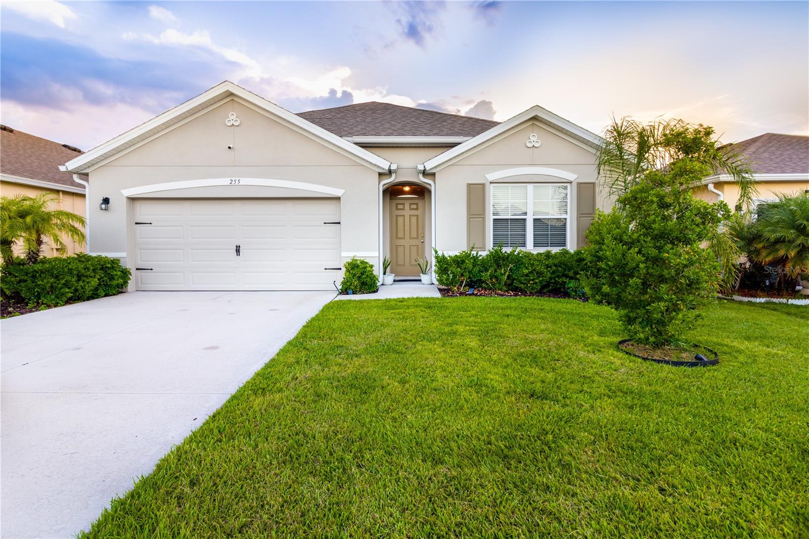 Stunning 4-Bedroom, 2-Bath Home in Brentwood Lakes! Located in a desirable gated community, this spacious home offers an open-concept layout, ceramic tile throughout, and a modern kitchen with large island & pantry. The primary suite provides a private retreat with a walk-in shower, dual vanities, and expansive closet. House includes hurricane shutters and Tesla Wall Connector (NACS) for convenient EV charging. Enjoy your large backyard from the comfort of a covered lanai, with plenty of space for entertaining. Community amenities include a pool and playground.The HOA also includes Internet and Cable TV. Centrally located and only minutes from 192, I-95, shopping, restaurants and entertainment! This home is a true gem—don’t miss your chance to make it yours!