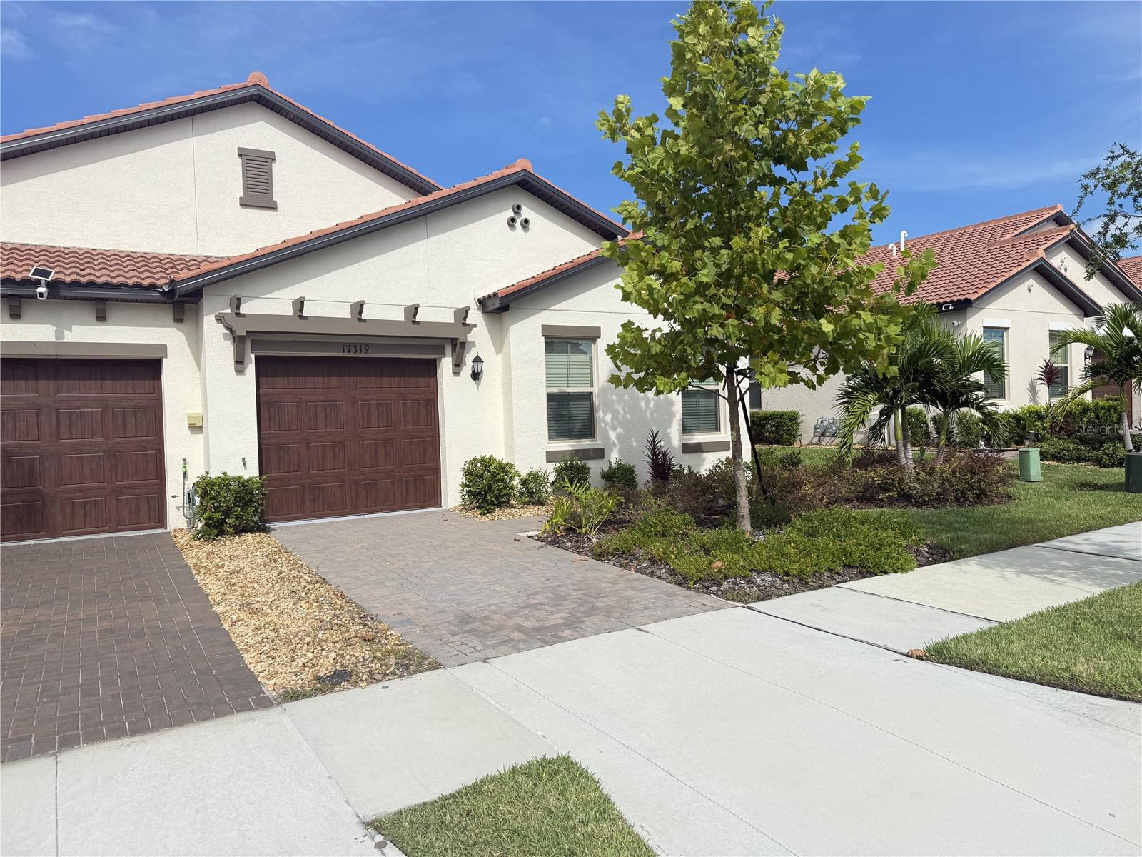 Welcome to this stunning 2-bedroom, 2-bathroom end unit villa in the 55+ community of Medley Southshore Bay." One of Tampa Bays best Active Adult Lifestyle Communities." This home offers an open floor plan with a bonus room. The high-end kitchen features a Thor Induction cooktop, quartz countertops, Wood plank style ceramic tile, coffee bar and a screened-in lanai with roll down shades. The Southshore Bay Community offers pickleball courts, fitness class in the state-of-the-art gym, a resort-style pool, tiki bar, business center, cardroom and grand ballroom for events. The bonus at the heart of the area is having exclusive access to the 5-acre lagoon. This offers a beach lifestyle with swimming, kayaking, paddleboarding or just lounging in this tropical paradise. Come enjoy the winter season or stay the whole year to see if the Florida lifestyle makes you feel like every day you're on vacation.