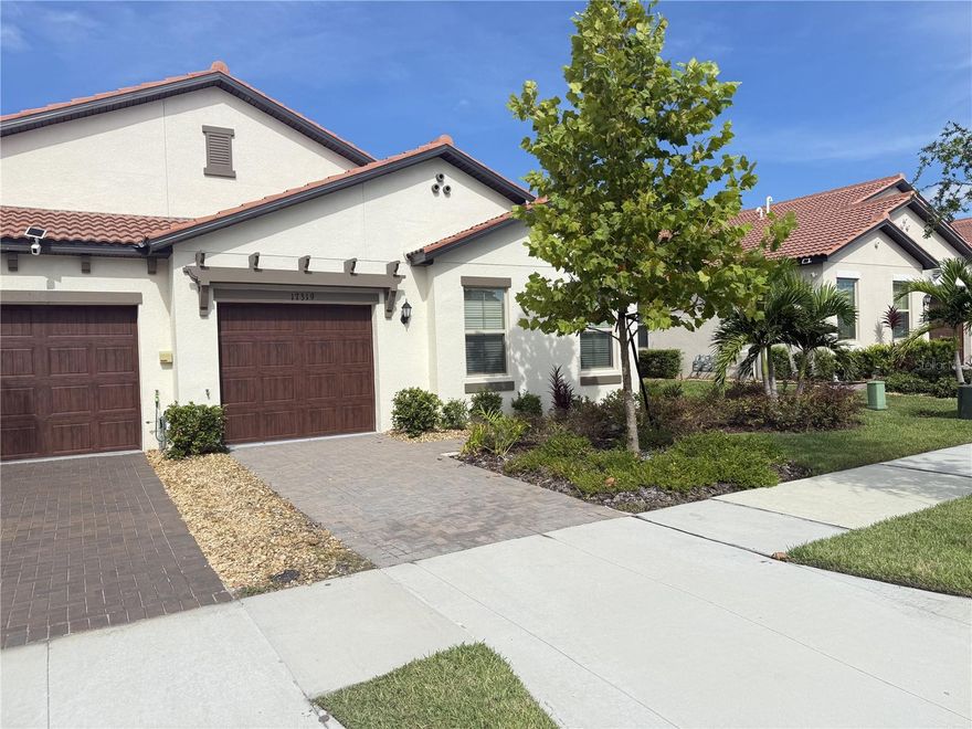 SEASONAL at the LAGOON - Welcome to this stunning 2-bedroom, 2-bathroom end unit villa in the 55+ community of Medley Southshore Bay." One of Tampa Bays best Active Adult Lifestyle Communities." This home offers an open floor plan with a bonus room. The high-end kitchen features a Thor Induction cooktop, quartz countertops, Wood plank style ceramic tile, coffee bar and a screened-in lanai with roll down shades. The Southshore Bay Community offers pickleball courts, fitness class in the state-of-the-art gym, a resort-style pool, tiki bar, business center, cardroom and grand ballroom for events. The bonus at the heart of the area is having exclusive access to the 5-acre lagoon. This offers a beach lifestyle with swimming, kayaking, paddleboarding or just lounging in this tropical paradise. Come enjoy the winter season or stay the whole year to see if the Florida lifestyle makes you feel like every day, you're on vacation.