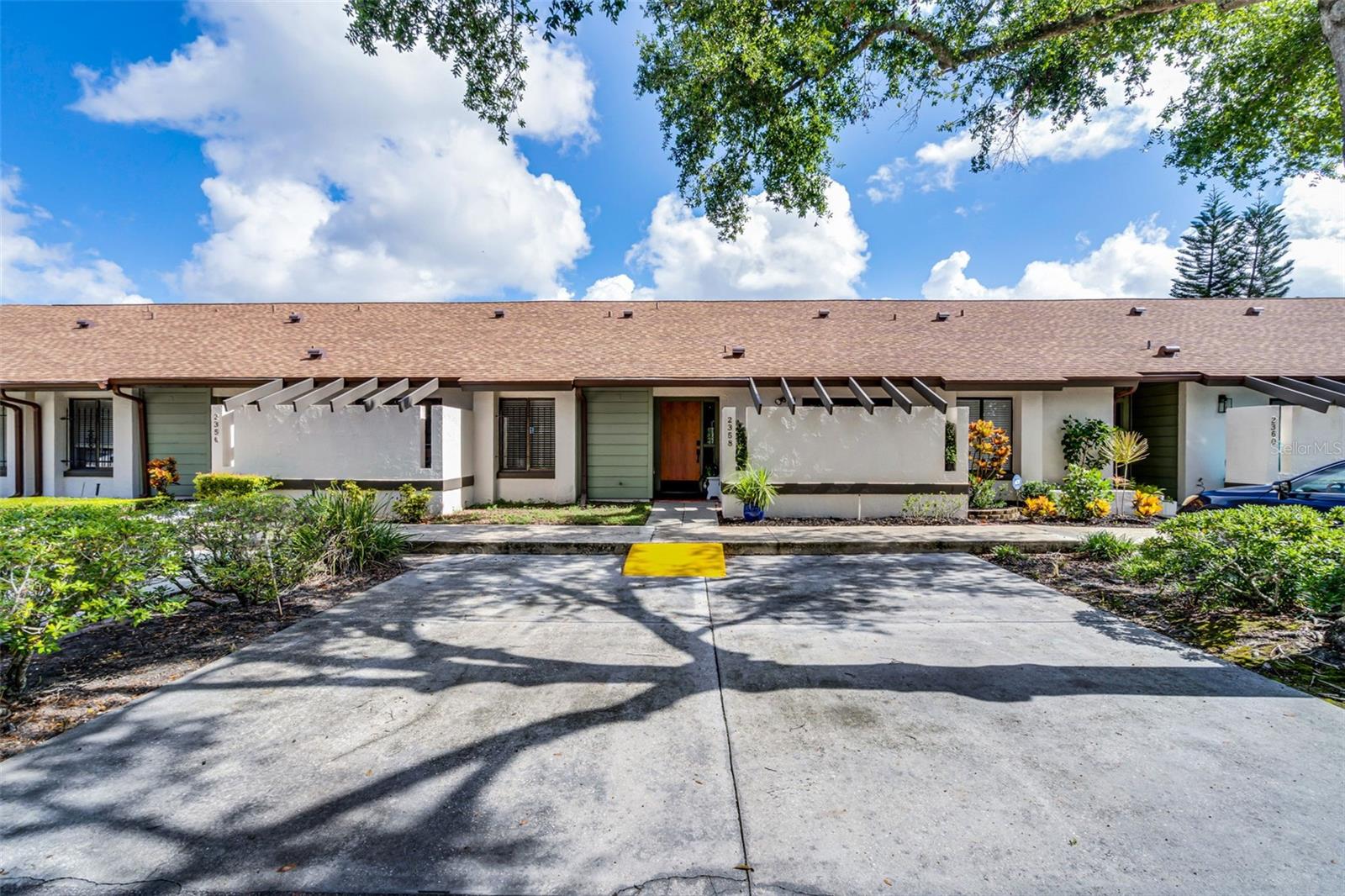Welcome to the established and well-maintained community of Cedarwood Village, located in highly desirable Winter Park! TREE-LINED STREETS lead you to this completely REMODELED single-story, 2-bedroom, 2-bath BLOCK-CONSTRUCTED condominium offering nearly 1,300 square feet of interior living space, plus an enclosed SUNROOM for year-round enjoyment. As you enter the foyer, you’ll immediately appreciate the attention to detail and pride of ownership. LUXURY VINYL plank flooring and designer paint were completed in 2024, setting the tone for a stylish, move-in-ready home. The open living and dining area features VAULTED CEILINGS, two skylights, and luxury light fixtures, creating a bright and inviting space. From here, enjoy serene views of the enclosed lanai and lush green space beyond. A WET BAR complete with wine fridge adds a perfect touch for entertaining. The kitchen is thoughtfully designed with 18" tile flooring, 42" light-toned cabinets extending all the way to the ceiling, soft-close drawers, GRANITE countertops, a farmhouse sink, ceramic tile backsplash, recessed lighting, and newer appliances. A charming eat-in nook overlooks your PRIVATE COURTYARD and is accessible through Pella HURRICANE-RATED sliding glass doors—perfect for morning coffee or outdoor dining. A tile-accented passthrough with pendant lighting opens into the formal dining area. For added convenience, the laundry closet with a stackable WASHER AND DRYER is tucked right into the kitchen. The primary suite is a peaceful retreat, featuring both a WALK-IN and step-in closet, lanai access through hurricane-rated sliders with INTEGRATED BLINDS and a beautifully REMODELED ensuite bath with a stylish vanity, FLOOR TO CEILING TILE, a large walk-in shower with custom accent tile, and frameless glass shower doors. The spacious second bedroom also features a walk-in closet and attached access to the second remodeled bathroom, offering privacy while still serving guests comfortably. Additionally, this home is located across from green space, has designated parking spaces with RAMP ACCESS, and a private mailbox. Upgrades include a whole-home WATER FILTRATION SYSTEM installed in 2023 ($6,000 value), water heater (2023), AC (2017), Pella doors (2017), interior doors (2023), and a stylish front door with electronic security lock (2024)—providing comfort, style, and peace of mind. With low HOA dues, residents enjoy access to a sparkling community pool, clubhouse, tennis and basketball courts, pickleball, a FENCED DOG RUN, and a pet walk with waste stations. Monthly fees also cover roof and exterior building maintenance, pest control, and landscaping. This ideal Winter Park location is just minutes to Park Avenue, UCF, Rollins College, Full Sail University, shopping, restaurants, entertainment, and medical facilities.