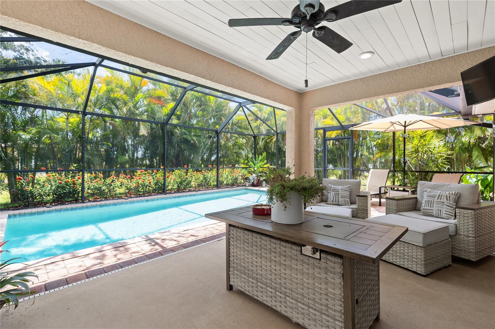 A Tropical Retreat- NO FLOOD INSURANCE Required! Featuring A RECENTLY RENOVATED- EXTENDED LANAI- Offers Endless Opportunities For Relaxation And Entertainment. From The Moment You Step Inside, Your Eyes Are Drawn To The TRIPLE SLIDERING GLASS DOORS Leading To The Spacious Covered Lanai Highlighted By A Wood Accented Ceiling, And An Expansive SALTWATER POOL, Beautifully Framed By Lush, Mature Landscaping That Provides Complete Privacy And A True Sense Of Retreat. The Kitchen Is Designed For Gathering, Showcasing A Stone-Accented Bar, Granite Countertops, A Stylish Backsplash, And A LARGE PANTRY, Creating The Perfect Space For Family And Hosting. The Primary Suite Provides A Private, Serene Escape With A Shiplap Accent Wall, A New Bath Fitter Shower With Glass Enclosure, And An Expansive Walk-In Closet With Custom Wood Shelving. Enjoy Peace Of Mind With A Newer Roof And Gutters (Less Than Two Years Old) And Impact Windows. The Home Also Features Stunning New Landscape Lighting, A Second Pantry In The Laundry Room, A Split A/C System In The Garage, And Pull-Down Attic Storage. Located In One Of Cape Coral’s Most Desirable Neighborhoods, Close To Shopping, Dining, Entertainment, And More. Whether You’re Seeking A Private Family Oasis Or A Prime Investment Opportunity, This Home Perfectly Captures The True Florida Lifestyle.