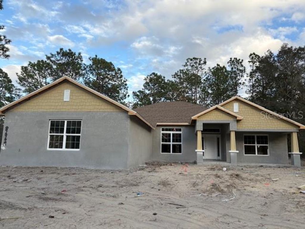 Photo of 8669 SW 138th Terrace, Dunnellon, FL 34432 (MLS # OM714341)