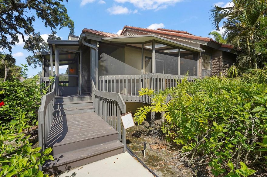 One or more photo(s) has been virtually staged. Tucked away in the sought-after community of Lakes of Sarasota, this charming corner-unit villa offers the perfect blend of space, privacy, and serene surroundings. With 2 bedrooms, 2 bathrooms, and almost 1,200 square feet of living space, this split floor plan home welcomes you with vaulted ceilings and a cozy fireplace that creates a warm and inviting atmosphere the moment you step inside. The kitchen is thoughtfully designed with ample cabinetry, granite countertops, and stainless steel appliances—ideal for both everyday living and entertaining. The spacious primary suite features a walk-in closet, an ensuite bathroom with a double sink vanity and stand-up shower, and a set of double doors that lead out to a peaceful screened-in deck. You’ll love the wrap-around screened-in porch, providing the perfect outdoor retreat to enjoy your morning coffee or unwind in the evenings, all while taking in the lush, mature landscape that surrounds the property. Lakes of Sarasota is known for its resort-style amenities and natural beauty. From the scenic walking paths and central lake to the community clubhouse, fitness center, tennis and basketball courts, and two pools—there’s something for everyone to enjoy. Located just minutes from Sarasota’s best beaches, shopping, dining, and entertainment options—including the Legacy Trail, Downtown Sarasota, Siesta Key, and UTC—you’ll find convenience and tranquility in one perfect location. All of this, plus low monthly fees that include exterior maintenance and common area insurance, makes this a wonderful place to call home.