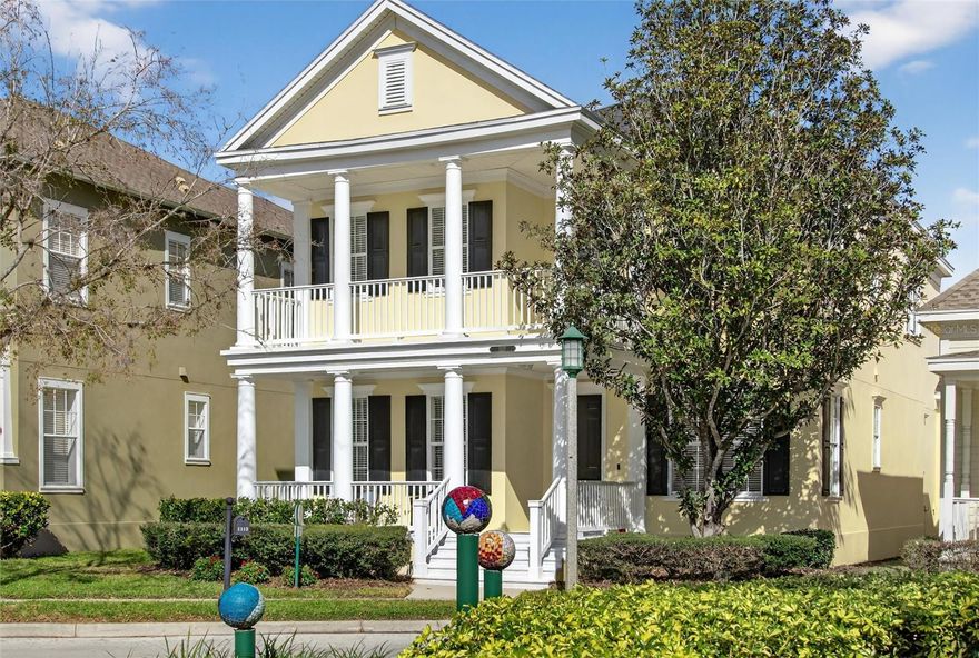 This popular LORIN model is in the quiet neighborhood of Artisan Park in Celebration. It faces a beautiful passive park with Artistic Mosaic tile balls to admire as you relax on either of your *DOUBLE COVERED PORCHES. The Interior is Freshly painted with crisp, neutral colors coordinating with * Luxury vinyl flooring throughout the first level. To the left as you enter the home is an extra-large * LIVING AREA [16x18] which offers flexible options for your personal lifestyle accommodation. To the right as you enter the home are glass paneled French Doors to create a perfect private *HOME OFFICE, Library or Formal Dining Room. *The KITCHEN has an oversized Granite Island for dining options, plus a * Large EAT-IN AREA [11.7x13]. * A BUTLER'S PANTRY separates the Kitchen from the Formal Dining Room or Home Office. An extra Large * Walk-in PANTRY with custom organized shelving is very convenient. *Stainless Appliances include a 2026 glass top range and oven and the counter coordinates nicely with the 42" cabinets. 
Conveniently located next to the kitchen is the *LAUNDRY ROOM with Front Load Washer and Dryer. The Open Floor Plan offers the Kitchen flowing to the * GATHERING ROOM [15x18] and extends to the SCREENED REAR PORCH which overlooks the large *PRIVATE FENCED AND PAVERED REAR PATIO. The second level has a Large * PRIMARY ENSUITE BEDROOM with a large custom walk-in closet. A special feature is access to the outdoor covered balcony which overlooks the peaceful streetscape. The Additional TWO BEDROOMS also have Organized Custom Closets. * ENERGY EFFICIENT, this home has a recent Dual-Zone AC system, 2021 Water Heater and 2019 ROOF. In addition to the Large * TWO CAR GARAGE with hanging storage shelves is a coveted * PARKING PAD for two full size vehicles. Enjoy the Artisan Clubhouse and amenities: Fitness Center, Resort Style Pool & Spa, Restaurant/Bar, Banquet Room, Outdoor Kitchen and planned activities.