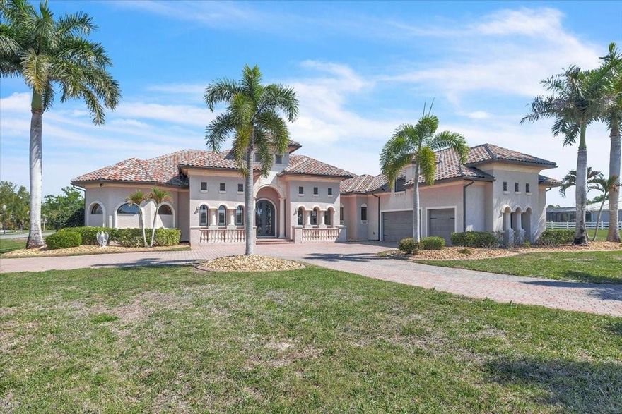 Welcome to this stunning custom residence, where timeless architecture meets the relaxed elegance of Florida living. Perfectly framed by towering palm trees and a sweeping brick paver driveway, this home makes an unforgettable first impression with its grand façade, arched entryway, and beautifully manicured landscaping. Architectural details shine throughout, from stately columns and decorative balustrades to the tile roof and refined exterior finishes that reflect a Mediterranean-inspired design. An oversized driveway and multiple garage bays provide ample space for guests and storage, while the lush surroundings create a private, estate-like setting. Situated within the exclusive, private gated enclave of The Estates on the Peace River, this extraordinary waterfront estate offers over 4,400 square feet of luxurious living on more than an acre, showcasing endless views of the Peace River and protected preserves. This custom-built, two-story Mediterranean masterpiece features 4 spacious bedrooms, 4.5 baths, a dedicated office, formal living and dining rooms, and a laundry room on the main level, with an upstairs fourth bedroom and full bathroom that can also serve as a media or game room. Exquisitely crafted, the home boasts soaring 16- to 20-foot coffered ceilings, 20-inch polished travertine flooring, 8-foot doors, solid wood cabinetry, granite countertops, stainless steel appliances, and a central vacuum system. The luxurious primary suite offers coffered ceilings, dual walk-in closets, and a spa-like bath complete with dual vanities, a jetted tub, and an expansive walk-through shower. Exceptional resort-style outdoor living awaits! This expansive screened lanai features a heated swimming pool with a built-in spa, offering the perfect blend of relaxation and year-round enjoyment. Designed for entertaining, the outdoor space includes ample lounging and seating areas set on elegant paver flooring, all protected by a full screen enclosure. The highlight is the tiki hut with a full kitchen, creating the ultimate outdoor entertaining and dining experience. Seamless indoor-outdoor flow and generous covered areas make this backyard a true private oasis—ideal for hosting gatherings or enjoying Florida’s outdoor lifestyle in comfort and style. Outdoors, the lush tropical landscaping is supported by a well-based irrigation system, while a three-car garage, brick paver motor court, and authentic clay tile roof complete this truly glamorous waterfront estate on the Peace River.  Community amenities include boat ramp, boat slip for each home site, fishing pier, and tiki hut for casual get-togethers.  For added opportunity and privacy, this property can also be combined with the adjacent Lot 20, available for an additional $150,000. **PLEASE ENJOY THE 3D INTERACTIVE VIRTUAL TOUR ASSOCIATED WITH THIS LISTING**
