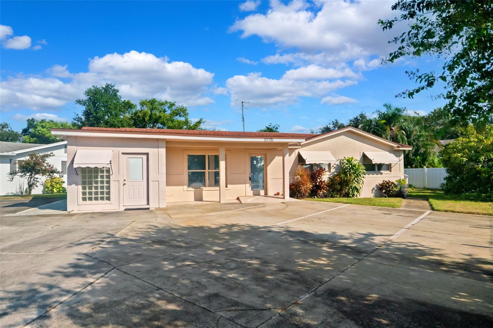 5 years from now whoever buys this is likely going to be look back and be glad they snatched this up while they could. One of the more versatile properties you will find in Pinellas County with huge upside and yet current practicality. Residential - yet zoned for office use. Whether you're looking for a home with business space (hello, tax write off), an income-producing or cost covering rental, a full-time residence or full-time office space this checks all the boxes. Currently set up as two separate spaces, you can run your business on one side and live in the other, rent out one side and work in the office space or any combination. Outside has plenty of parking and great visibility for signage and access. With a few tweaks you have a 1,500+ sq ft home with 3 bedrooms, 2 bathrooms and a den as well.